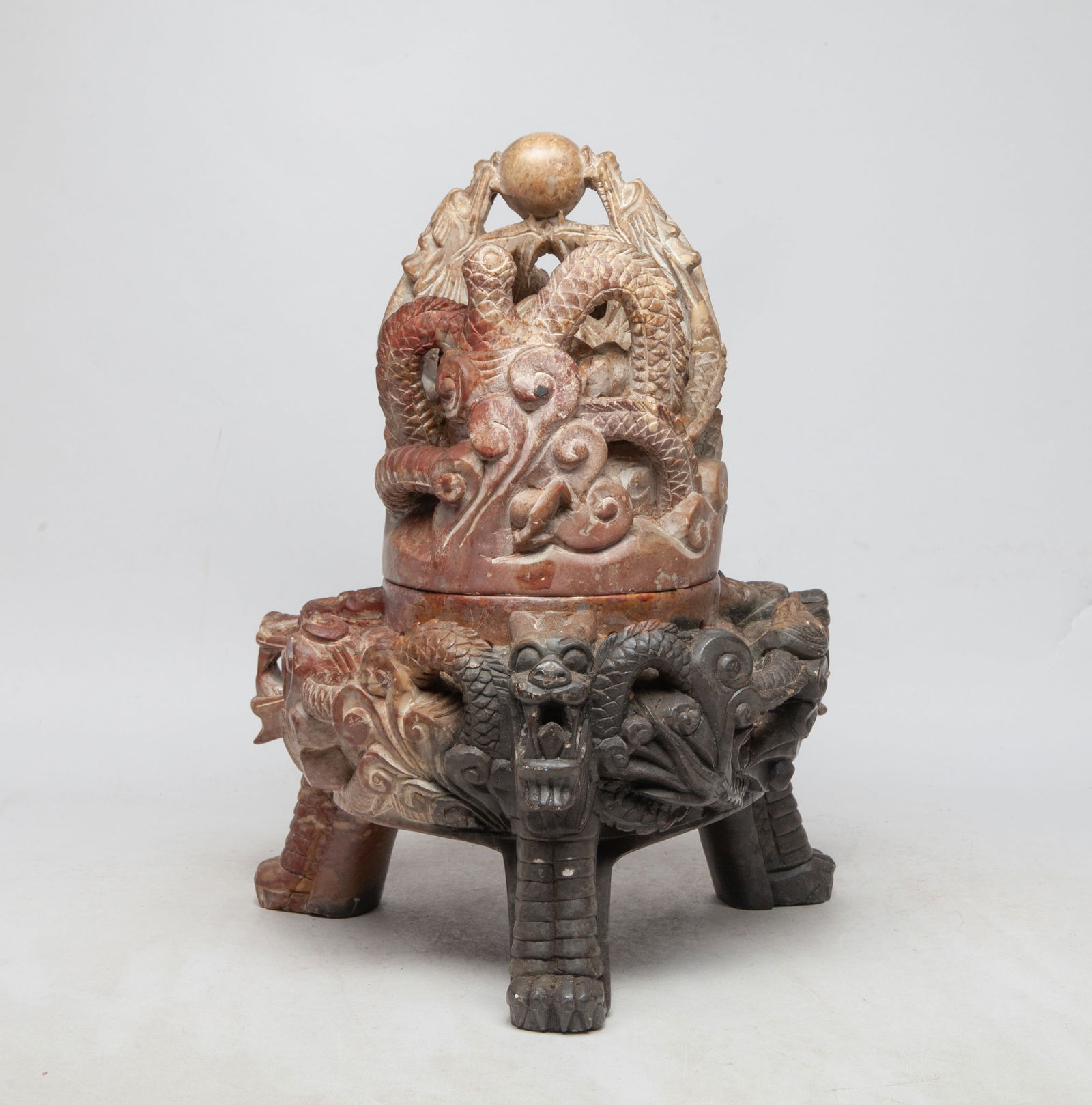 Massive Chinese Export Stone Censer: Massive heave Chinese stone censer, carved and reticulated with sinuous dragons chasing a ball, supported on three paw for legs. Approx. 13*9.5 inch.