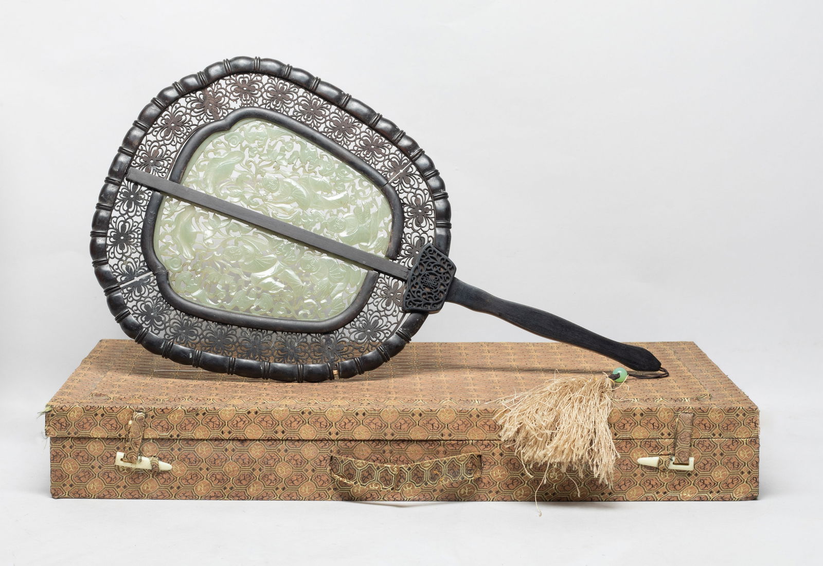 Large Chinese Wood Fan Inlaid Old Jade: Chinese wood fan, inset with jade plaques carved in openwork with Hehe Erxian among foliage, one holding a box and the other holding lotus, the border reticulated with stylized flowers, with box. Appr
