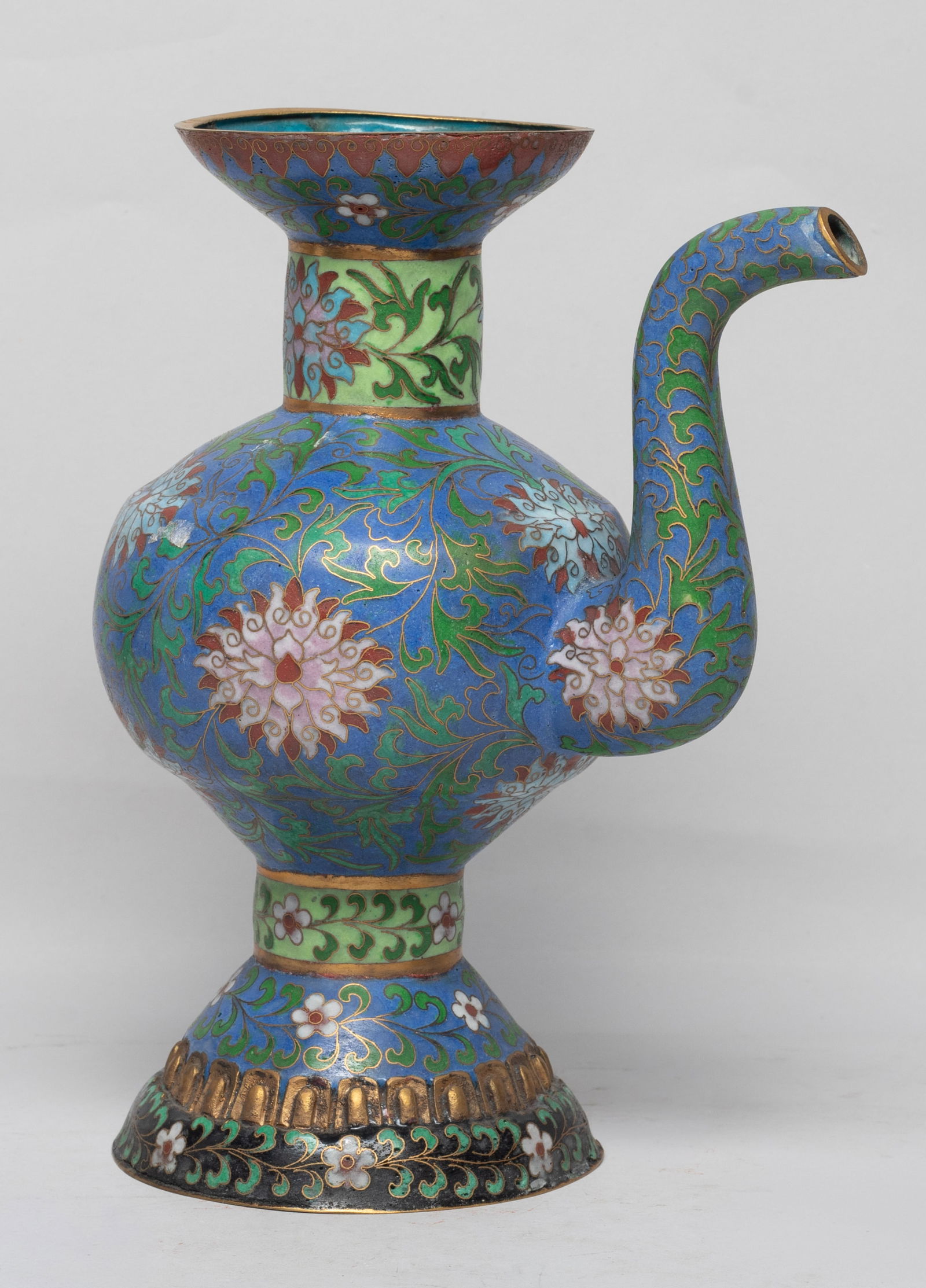 Chinese Temple Used Cloisonne Pot: The ovoid body rising from a tall splayed foot to a cylindrical neck and flared rim, the body and neck enameled with leafy lotus foliage on blue and pale green ground, the foot enameled with flowers o