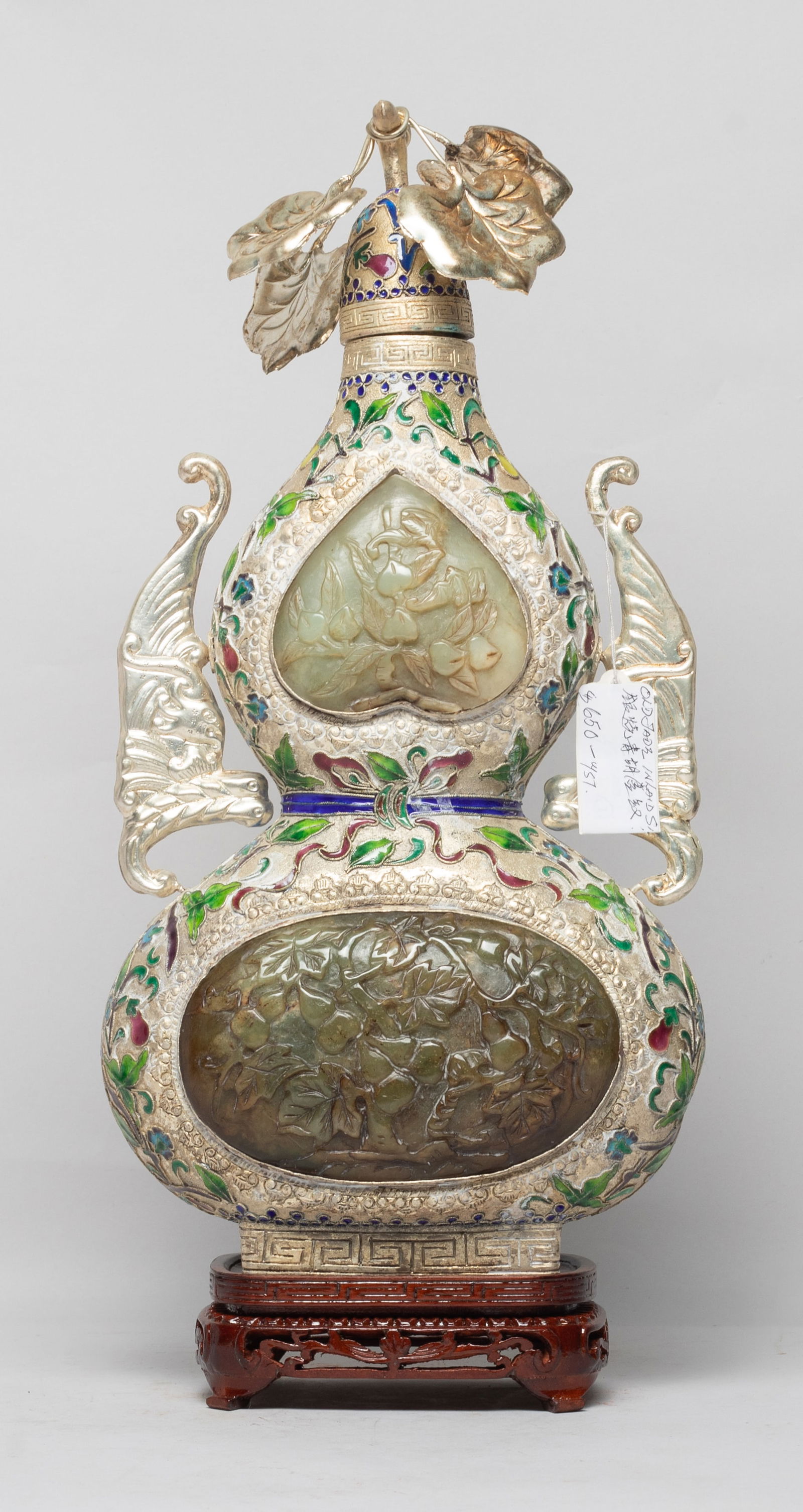 Tall Chinese Enameled Inlaid Jade Stone Vase: Of flattened double gourd form, flanked by a pair of bat handles, the upper body either side inset with a peach-shaped jade stone panel carved with peach stems, the lower body either side inset with a