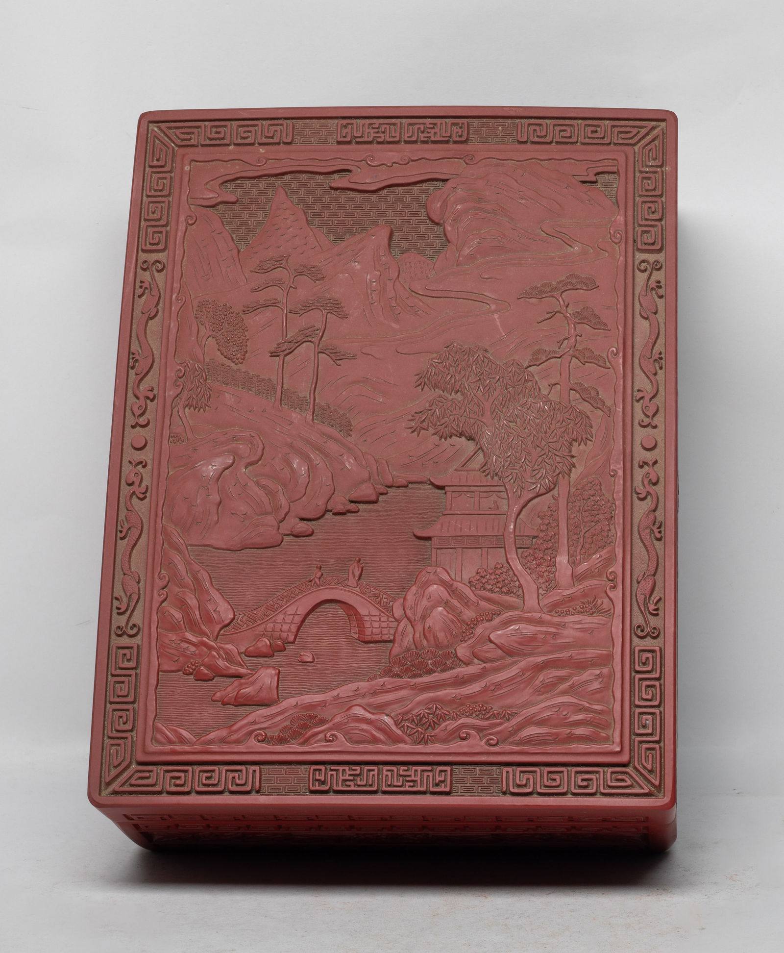 Large Asian Export Box: Of rectangular section, the top carved with landscape scene, the sides carved with bands of flowers and scrolls. Approx. 12*9.1*4.1 inch.