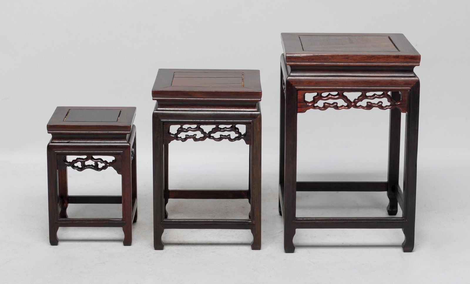 Chinese Export Wood Stands: Set of three Chinese wood table stands. Approx. 6.6*4.3*4.3 inch (largest). The Estate of the Store Closed Sale, Los Angeles. 2022.
