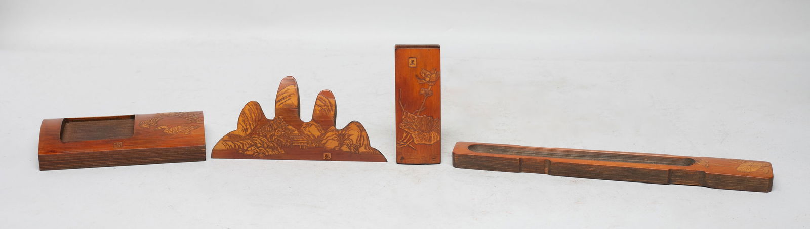 Chinese Bamboo Carved Pieces: Including a brush stand carved with landscape, an ink stone carved with lotus and bird, a paper weight and a case carved with lotus. Approx. 8.5*1.2*0.4 inch (largest). The Estate of the Store Closed