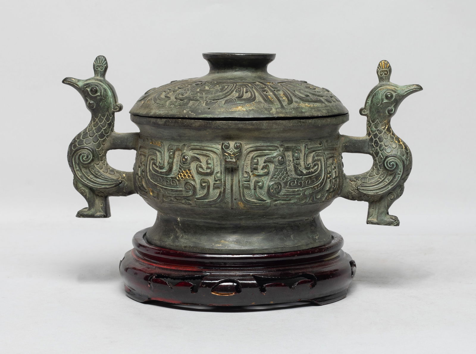 Chinese Bronze Censer w/ Base: Of U shape rising from a splayed foot to a broad mouth, the body and lid exterior cast with archaistic birds on leiwen ground, flanked by a pair of bird form handles, with wood base. Approx.