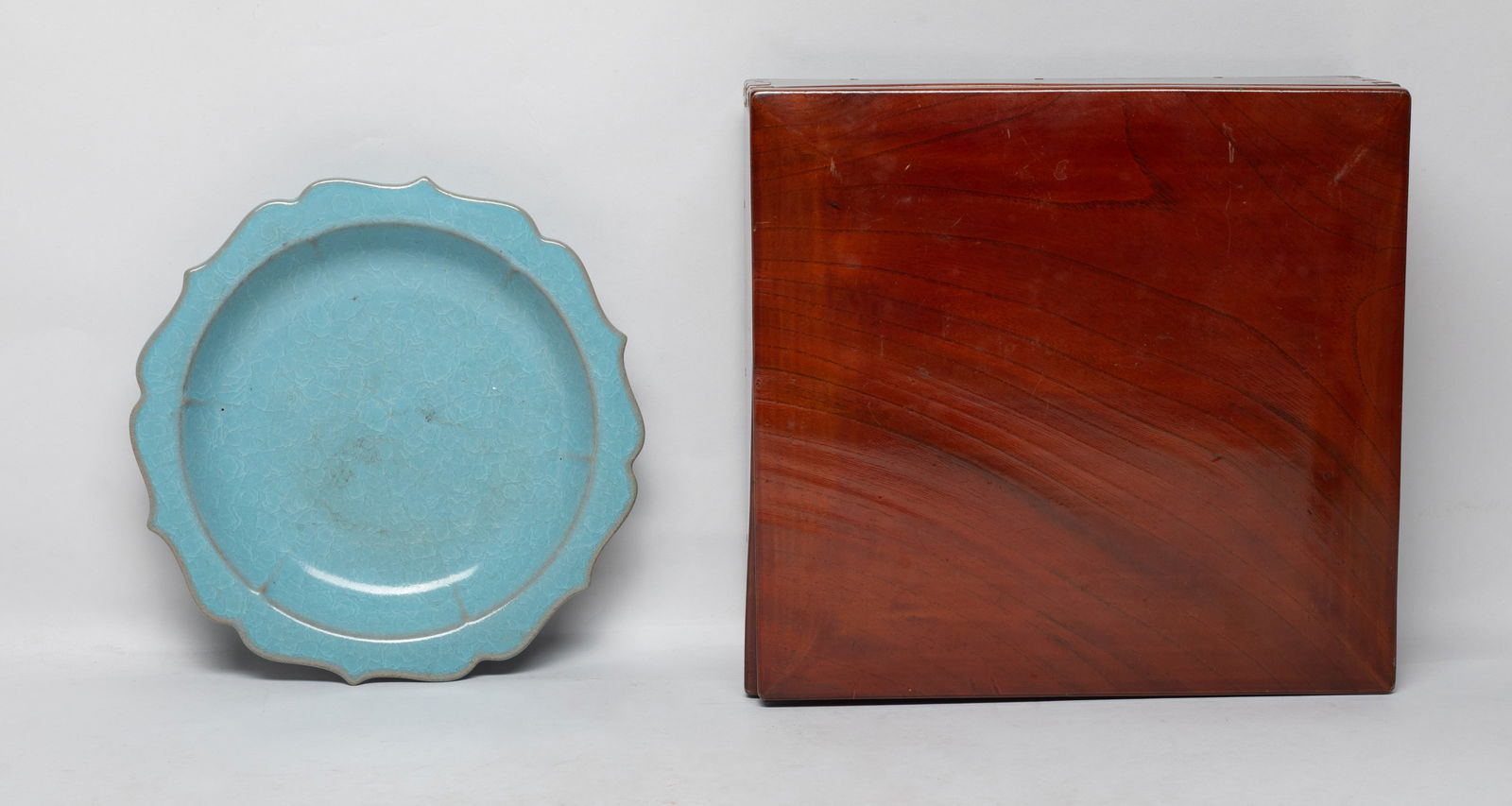 Estate Chinese Light Celadon Porcelain Plate: The plate molded of floral form, overall covered with crackled sky blue glaze, with box. Approx. 7.1 inch D. The Estate of the Store Closed Sale. Palm Springs. CA. 2021.