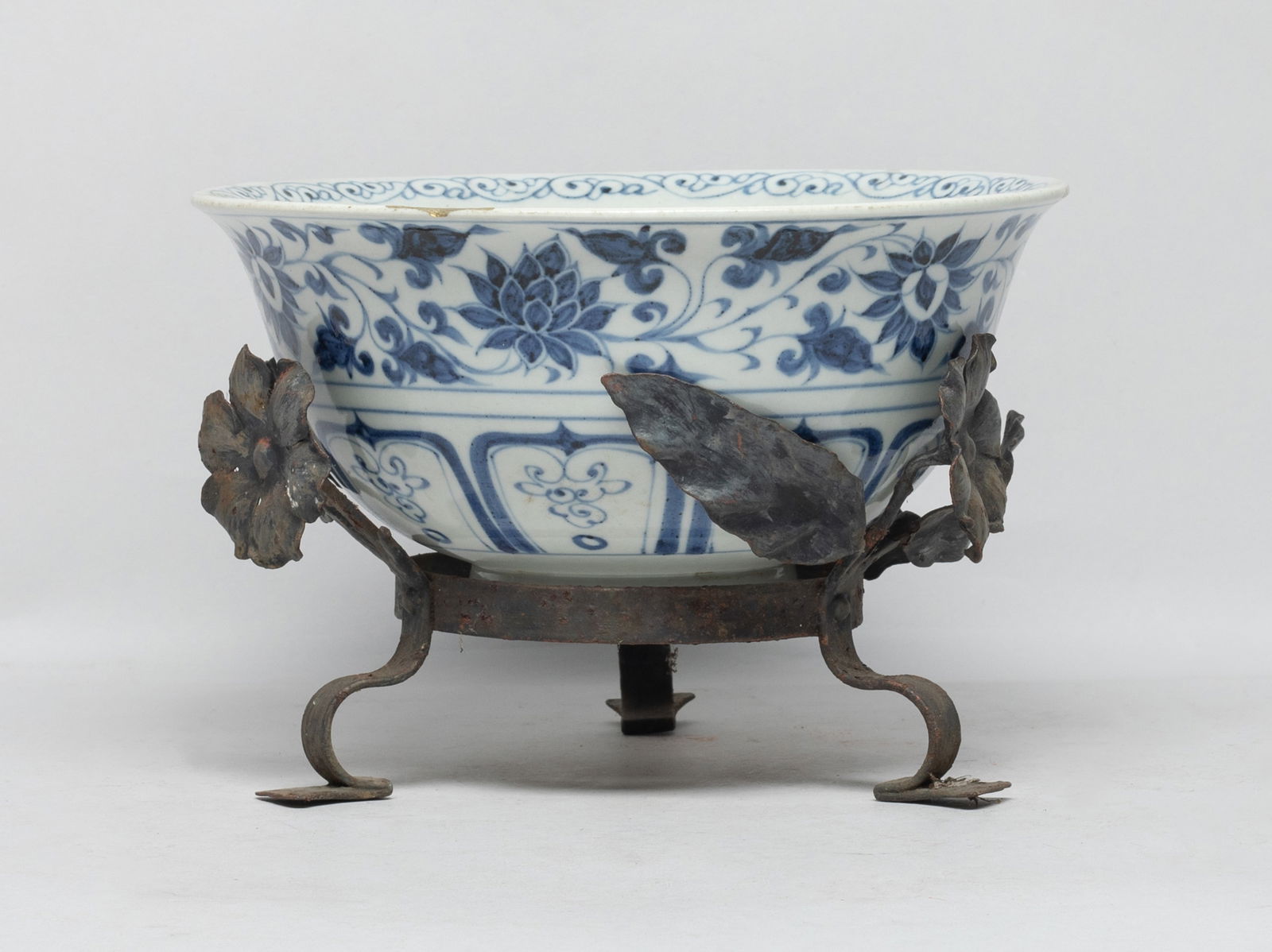 Large Chinese Export Porcelain Bowl: The bowl interior carved in low relief with two five-clawed dragons sinuous amidst clouds surrounding a central lotus enclosing treasures in petals, the exterior painted with meandering lotus sprays a