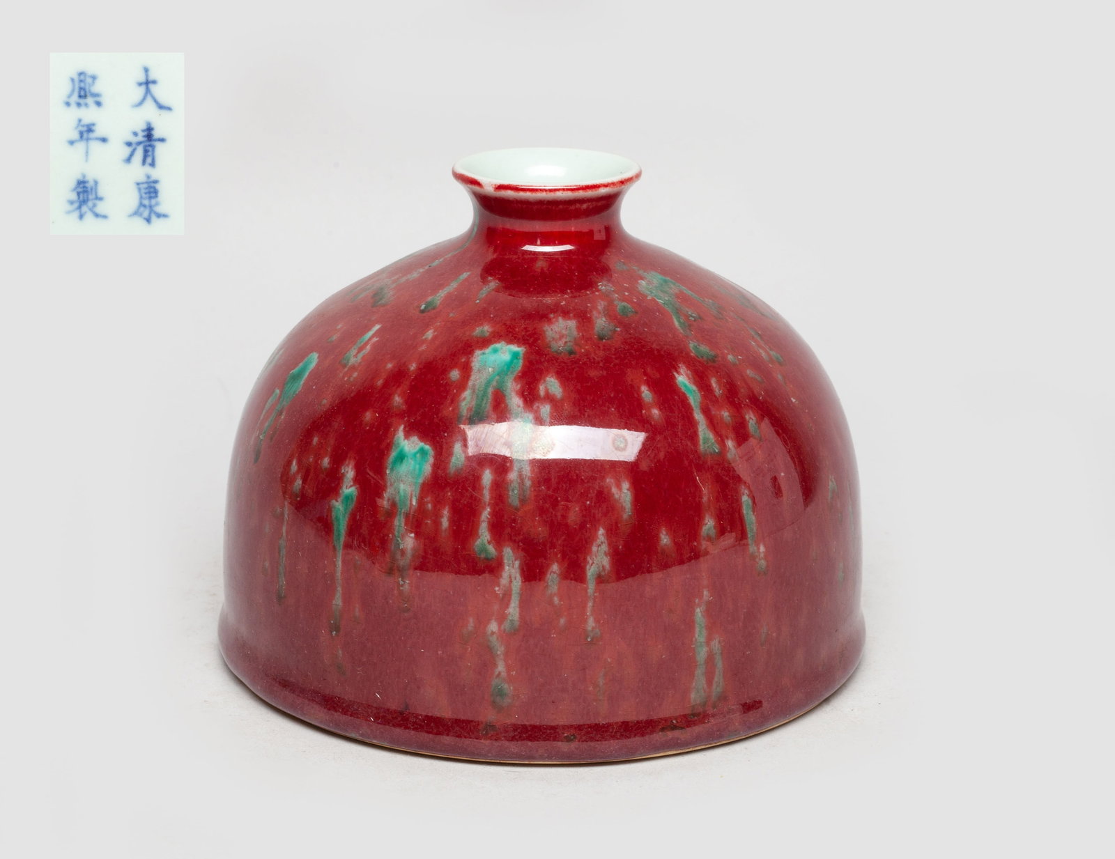 Chinese Export Porcelain Water Pot: The ovoid body with a short waisted neck, the exterior applied with crackled red glaze suffused with green inclusion, the bottom marked with six characters. Approx. 5.2*4 inch.