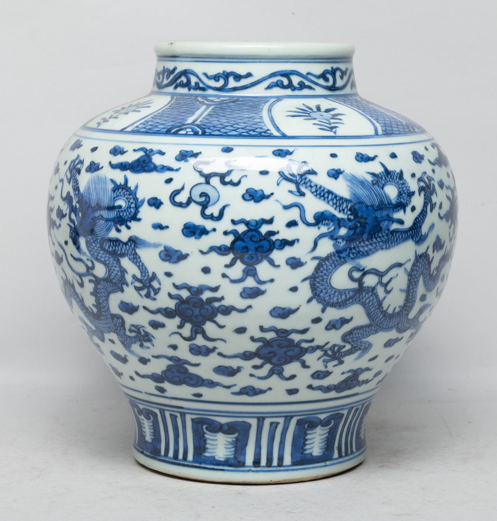 Estate Chinese Export Porcelain Vase: Of tapered ovoid form, the exterior painted with five-clawed dragons pursuing flaming pearls amidst clouds, under a band of flowers, above a band of upright lappets. Approx. 9.6*9.2 inch. The Estate o