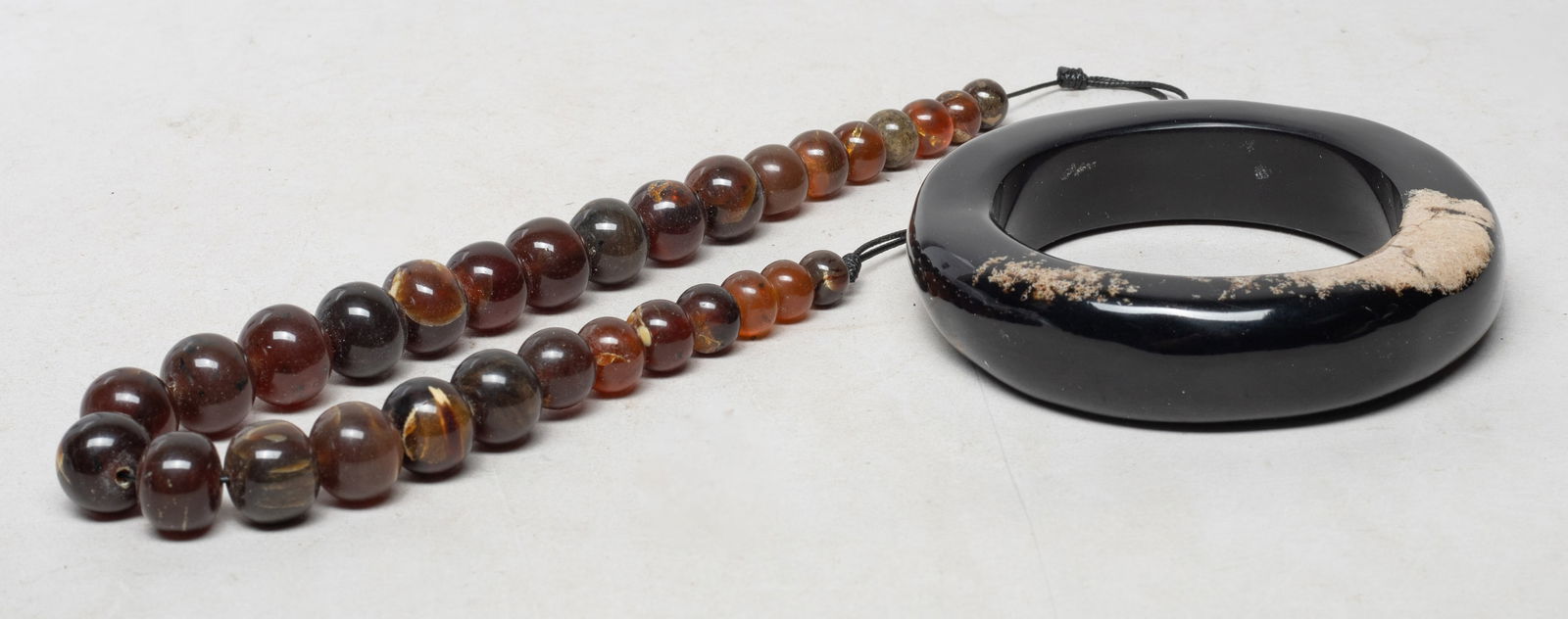 Asian Root Amber Necklace & Strong Bangle: Including an Asian root amber carved bead necklace and a strong bangle. Approx. 162 gram (total amber weight), 4.5 inch outer diameter, 3 inch inner diameter (bangle size).