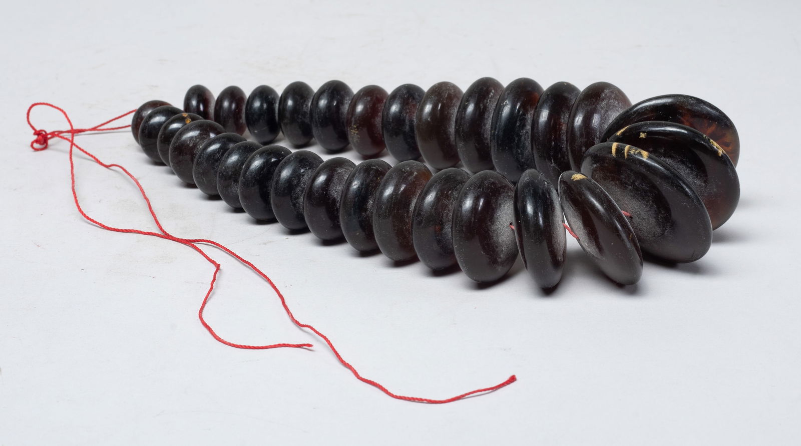 Chunk Dish Beads South Asian Amber Necklace: Collectible South Asian amber carved chunky dish bead. Approx. 265 gram (total weight), 2 inch D (largest bead).