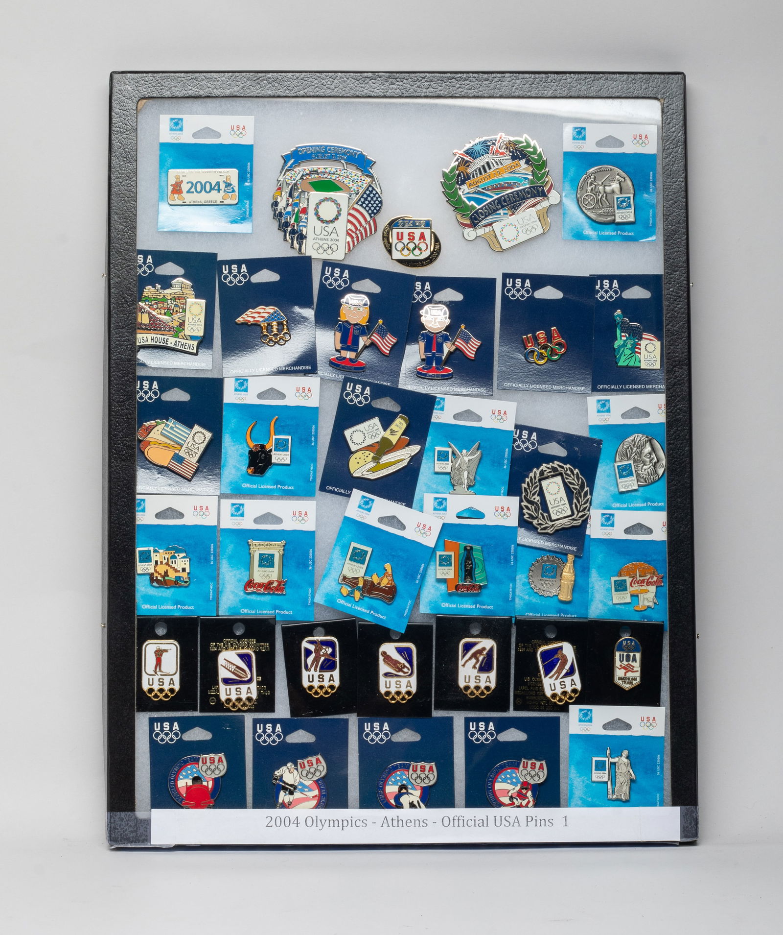 Groups 2004 Olympics Athens Official USA Pins: Groups of 2004 U.S.A. Athens Olympics official pins, with case. Size varies.