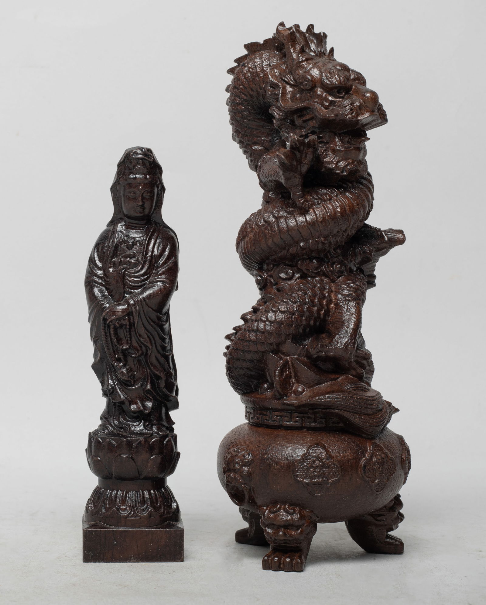 Chinese/ South Asian Painted Agarwood Sculptures: One sculpture carved as a ferocious dragon coiled over a censer, the other carved as Kuanyin standing on a lotus base, wearing a long flowing robe. Approx. 425 gram (total wood weight), 2.8*7.1 inch (