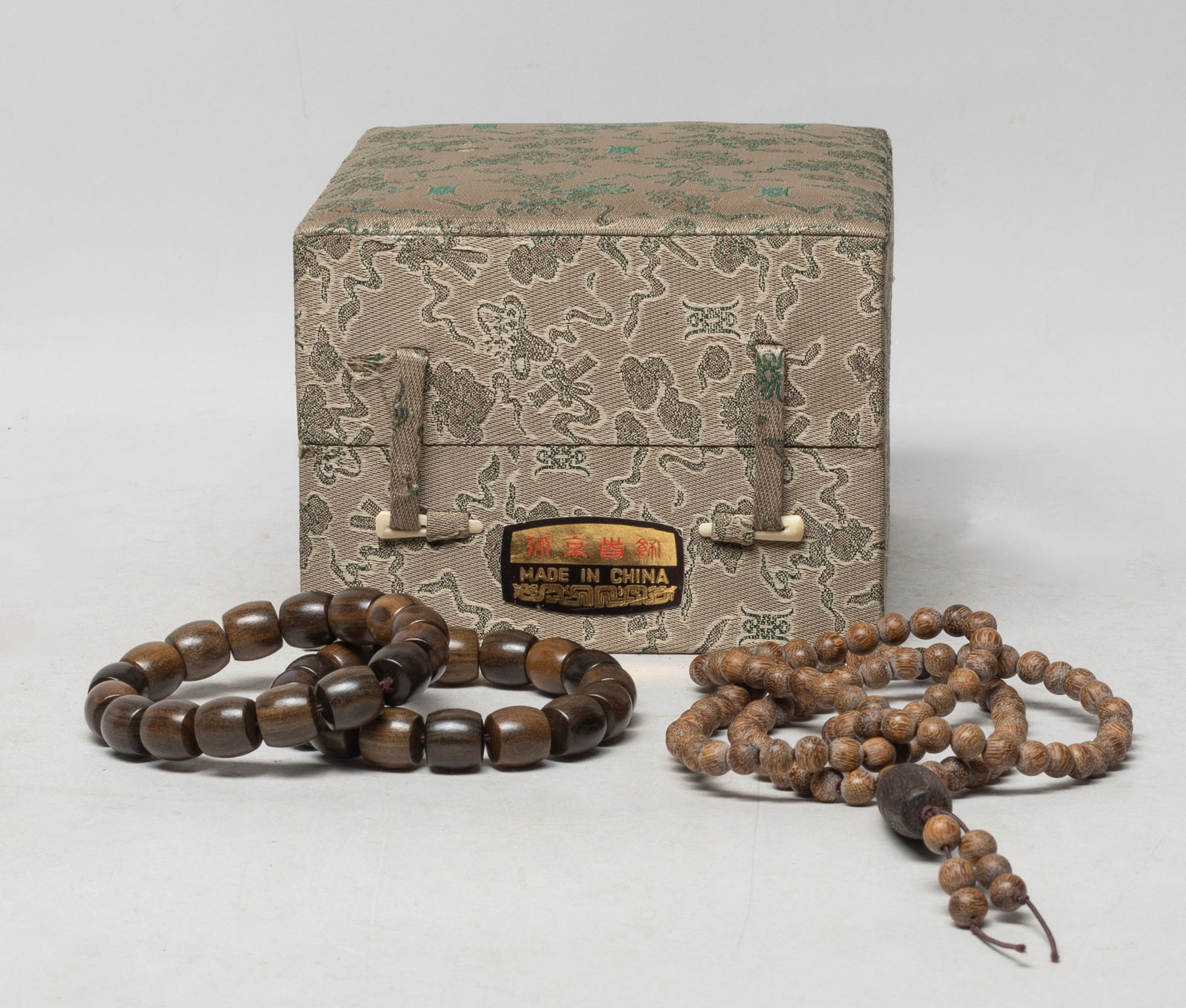 Vintage Chinese Agarwood Necklace, Prayer Beads: Including two strings of Chinese agarwood carved prayer beads, and a long agarwood bead necklace, with box. Approx. 95 gram (total bead weight), 32 inch L (necklace size).