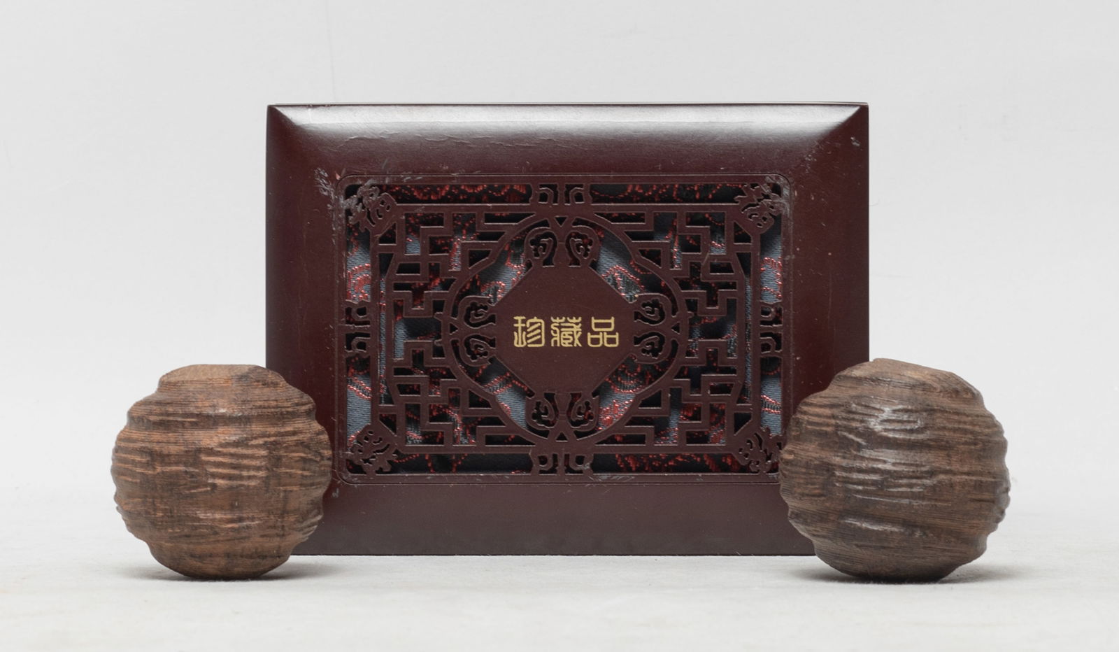 Two South Asian Agarwood Balls: Two collectible South Asian agarwood balls, with box. Approx. 98 gram (total wood weight), 1.73*1.66 inch (larger ball size).