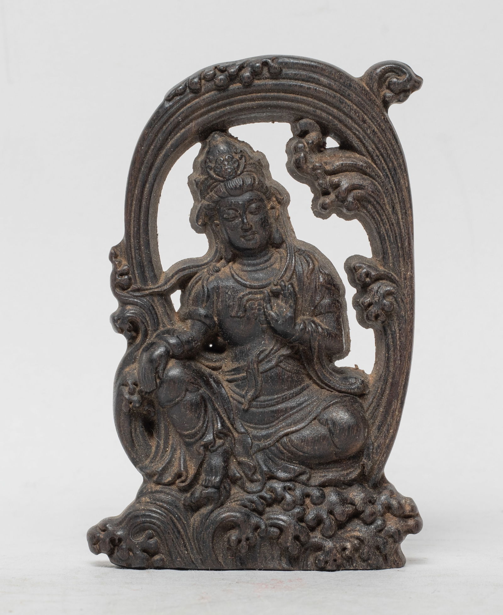 Chinese Agarwood Carved Plaque: Carved with Buddha seated on foaming waves, the left hand in shuni mudra and right hand resting on knee, the waves foaming a halo on his back, slightly fragrant. Approx. 32 gram (total wood weight), 3