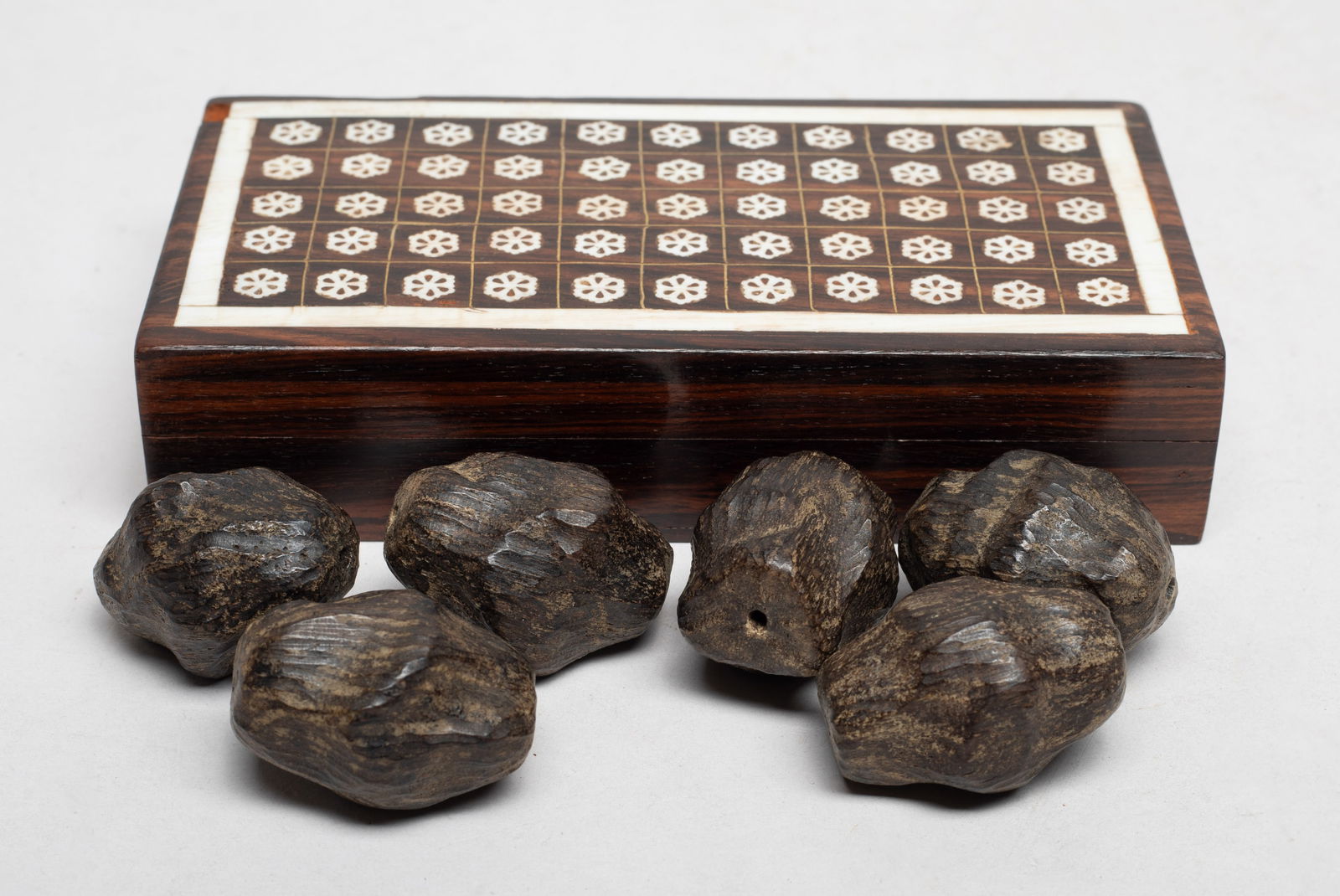 Box of Chinese Agarwood Beads: Set of Chinese six agarwood carved large nugget shaped beads, with box. Approx. 100 gram (total wood weight), 1.58*1.22 inch (largest nugget). .