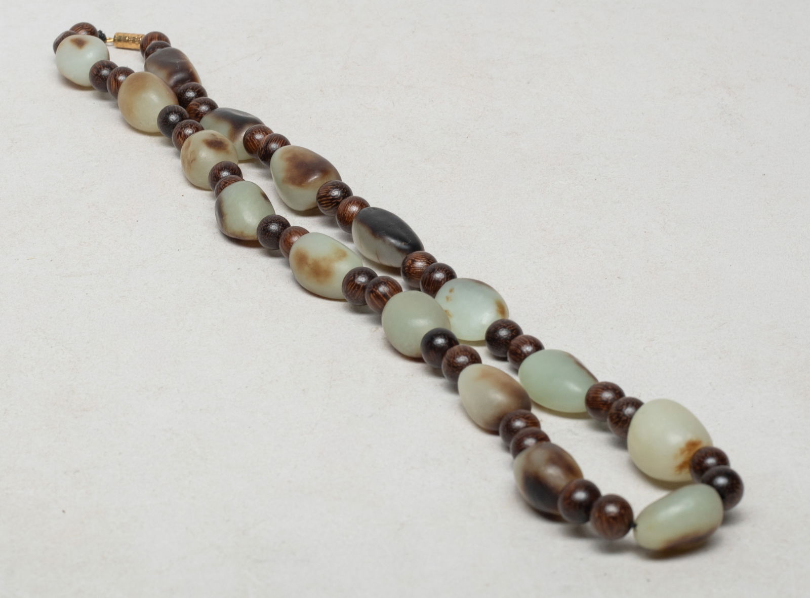 Vintage Chinese Agarwood, Russet Jade Necklace: Chinese agarwood and russet jade carved bead necklace. Approx. 22 inch L.