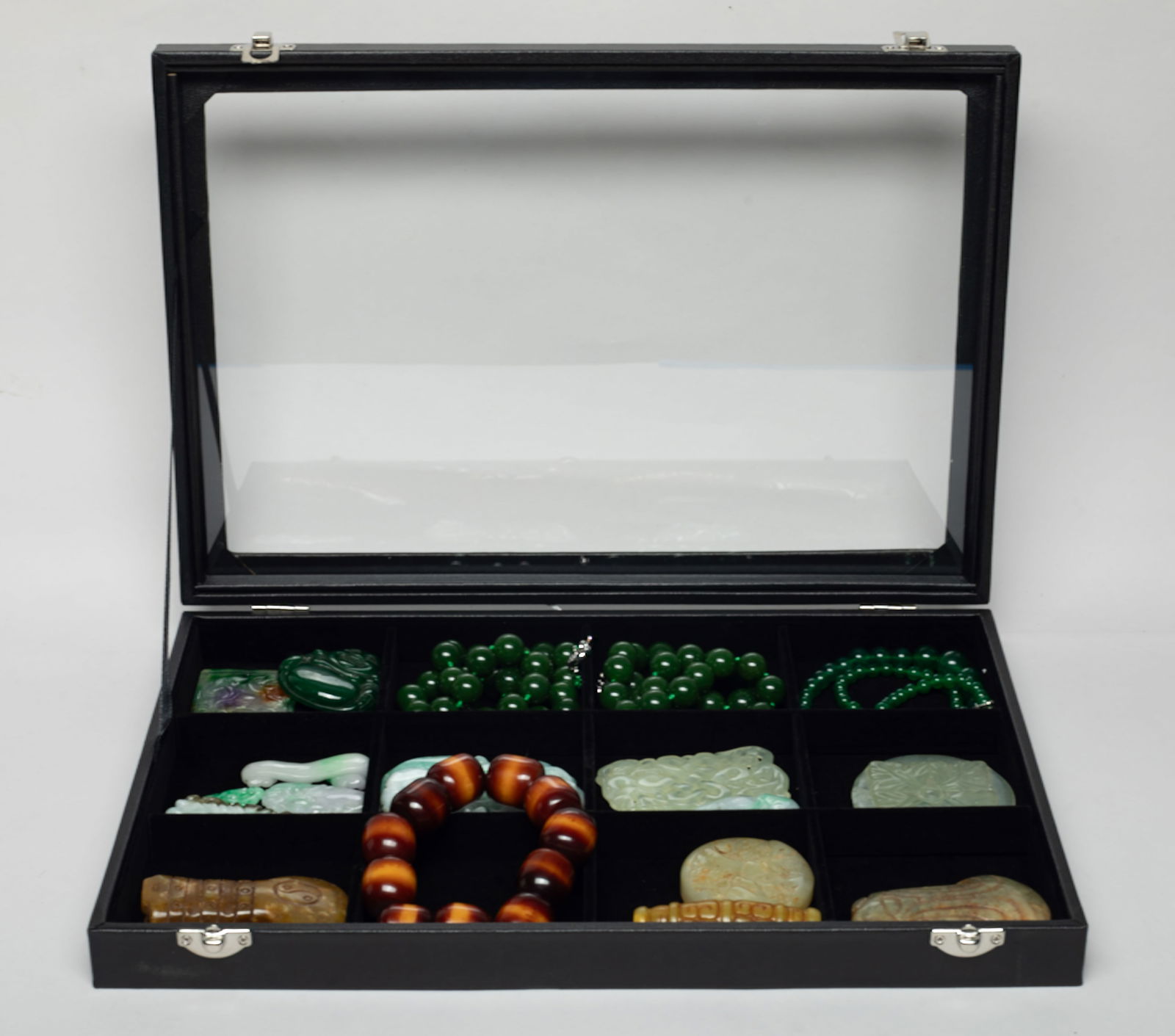 Box of Chinese Export Colored Stone Jewelry: Including bead necklaces and pendants, the pendants carved with flower, landscape, lingzhi, dragon, bamboo, and traditional patterns, with case. Size varies.