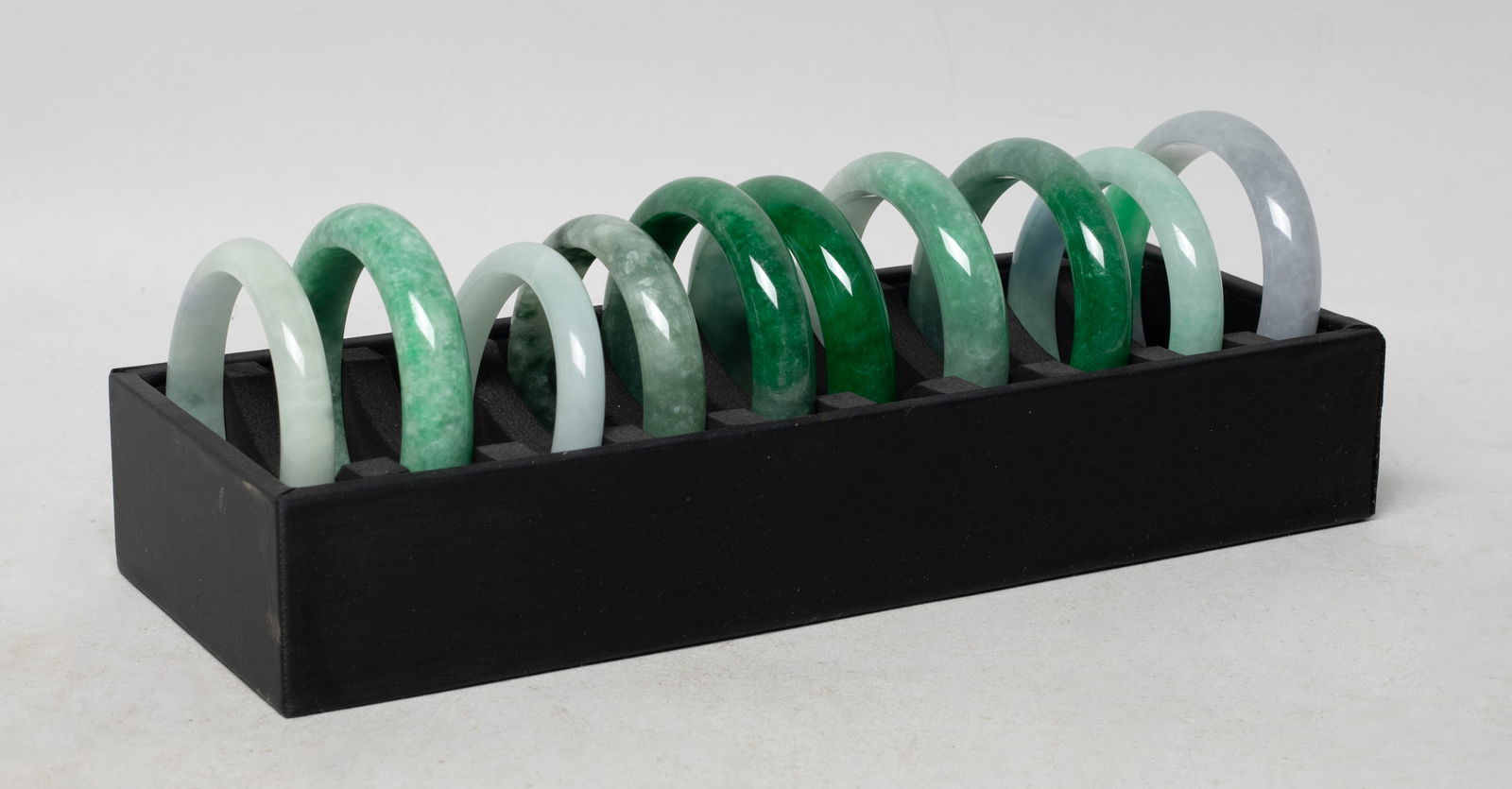 Estate Set Chinese Export Bangles: Set of ten Chinese bangles, with case. Approx. 2.95 inch outer diameter, 2.37 inch inner diameter (largest).