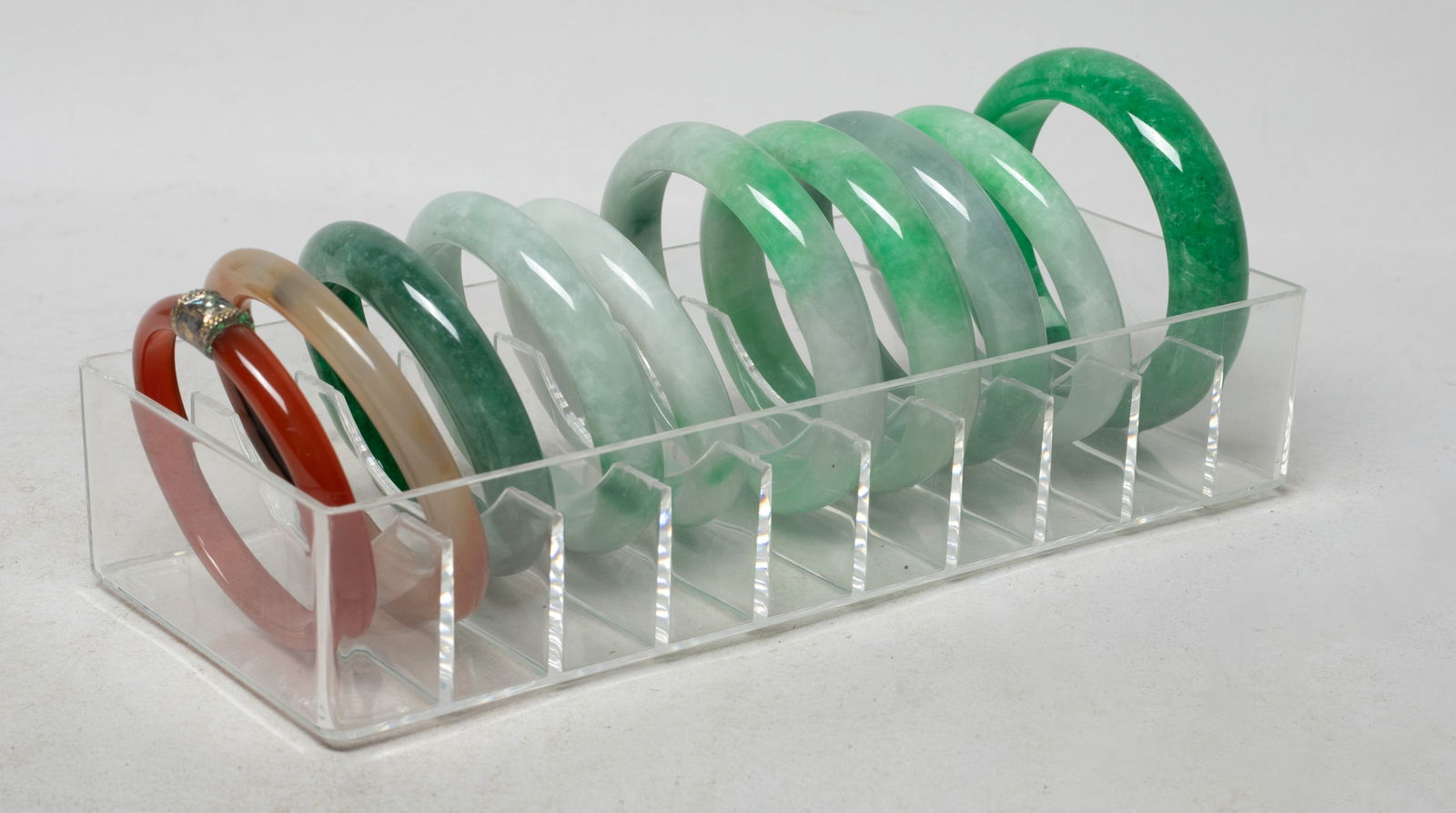 Set Chinese Export Bangle Collections: Set of ten Chinese bangles, with case. Approx. 2.97 inch outer diameter, 2.33 inch inner diameter (largest).