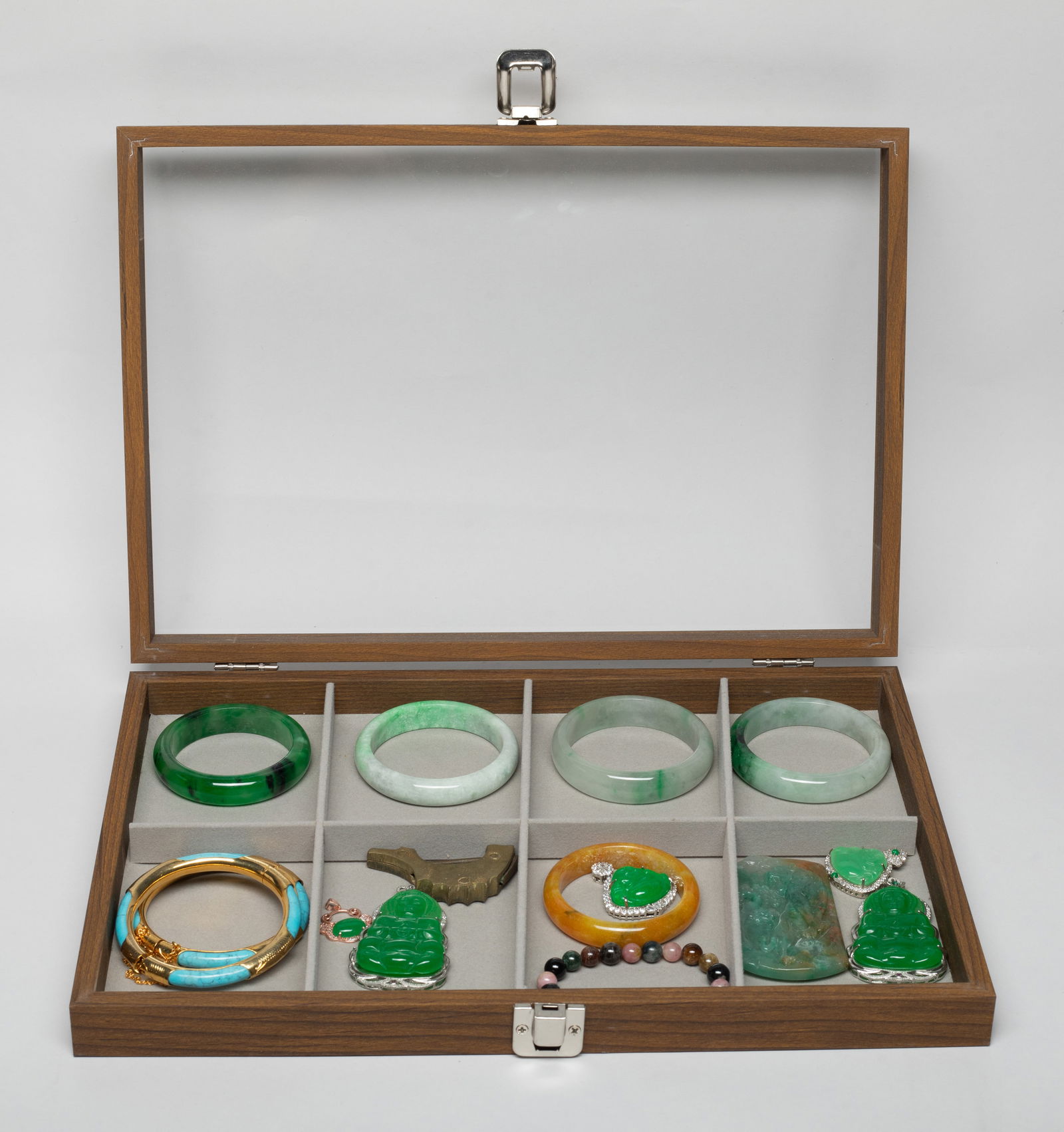 Estate Set Vintage Chinese Export Jewelry: Including colored stone bangles, Buddha form pendants, a ruyi head form pendant, a bead bracelet, a plaque carved with beast and pine tree, and a lock, with case. Approx. 2.88 inch outer diameter, 2.3