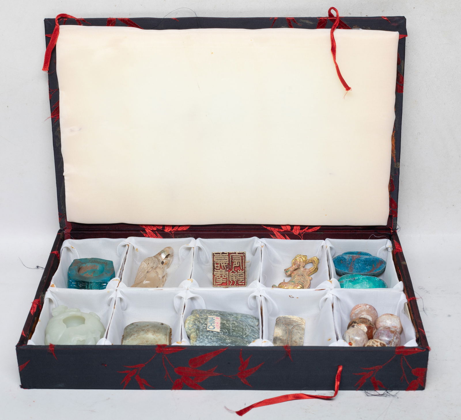 Estate Chinese Jade, Glass, Bronze Collections: Including six beads, a seal, a Buddha sculpture, a cicada toggle, a bird toggle, a goose form glass sculpture, a plaque carved bird, a glass cong, a washer, and two dishes, with case. Size varies.