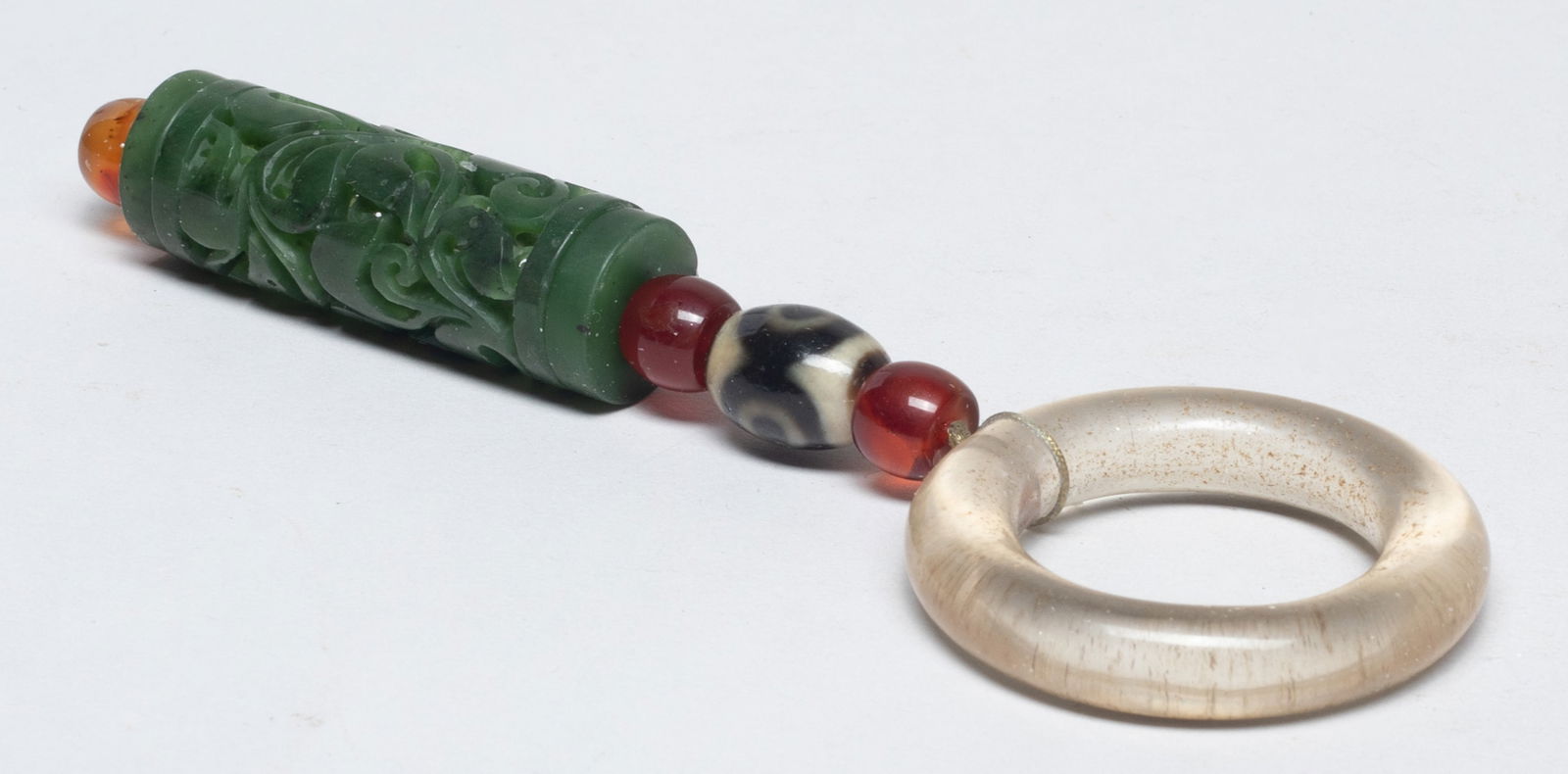 Chinese Crystal, Spinach Jade Pendant: Including a spinach jade pendant, carved in openwork with foliage patterns, a clear crystal huan, and four agate beads. Approx. 2.17*0.7 inch (jade size).