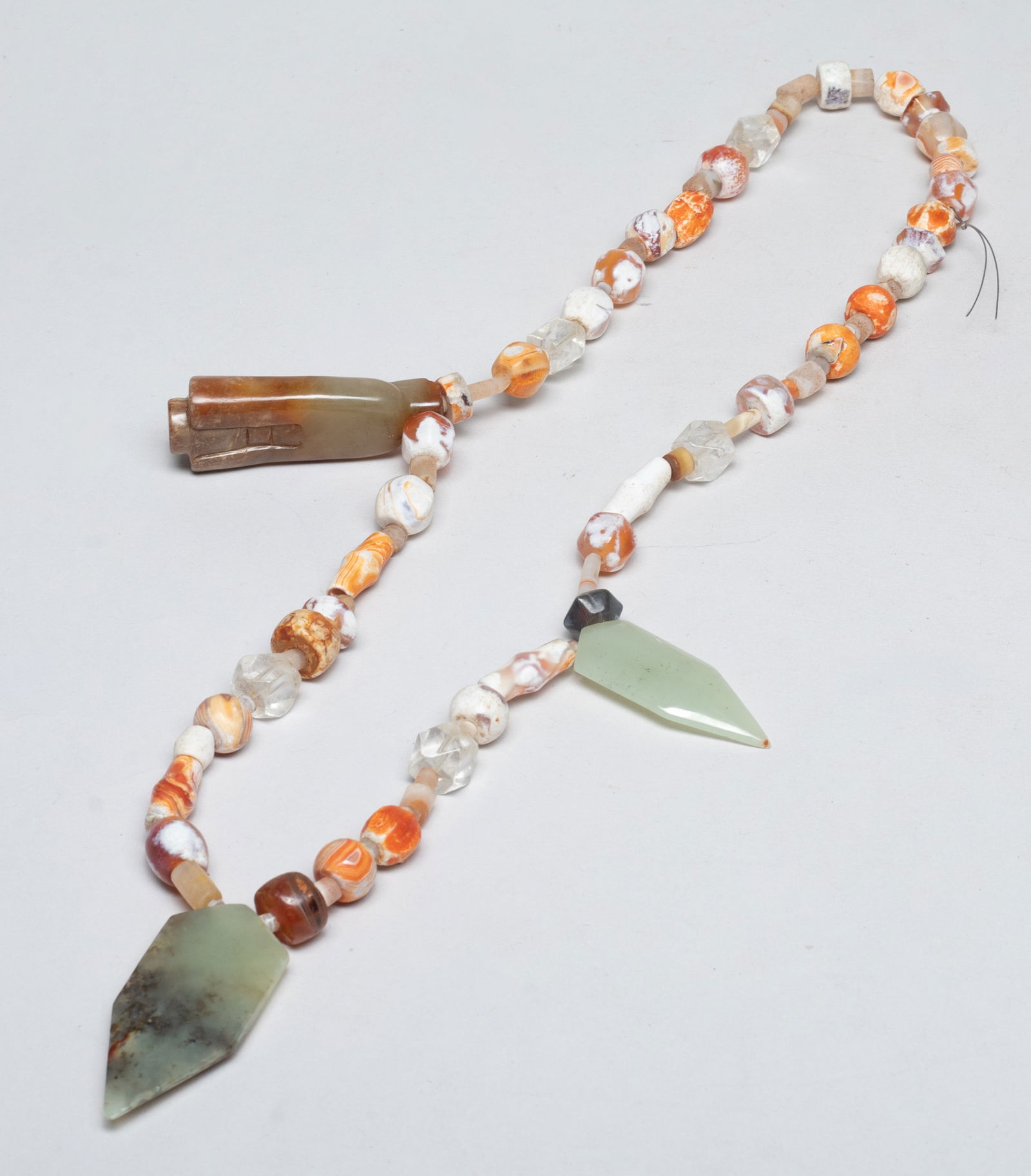 Chinese Jade, Cameo Agate Necklace: Chinese cameo agate and crystal bead necklace, with three russet jade pendants, the largest jade pendant carved of figure form. Approx. 24 inch L.