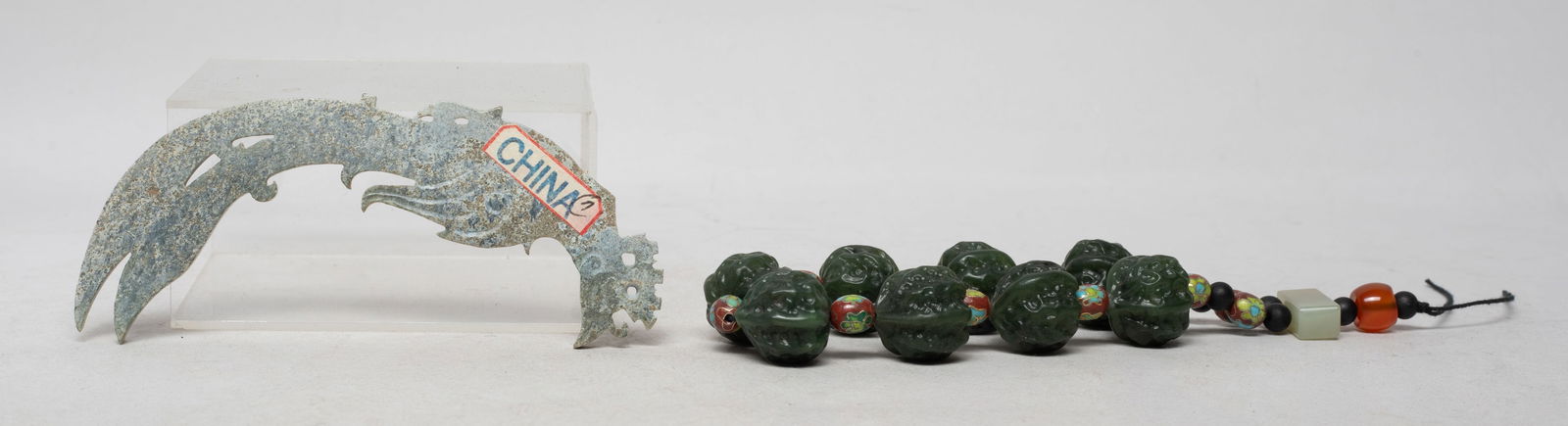 Estate Chinese Export Jade Beads & Lg Pendant: Including a string of cloisonne beads and spinach jade carved walnut form beads, terminating with wood beads, an agate bead, and a jade bead, and a large pendant carved of archaistic bird form. Approx