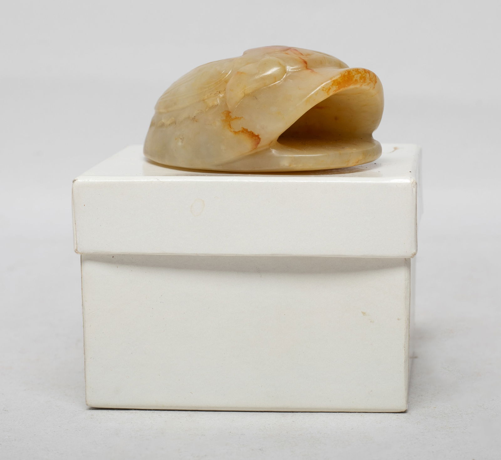 Chinese Russet Jade Carved Sculpture: Special shape Chinese russet jade sculpture, one side carved in raised relief with an archaistic beast, the reverse incised with ancient characters, with box. Approx. 2.3*1.6*1 inch (w/o box).