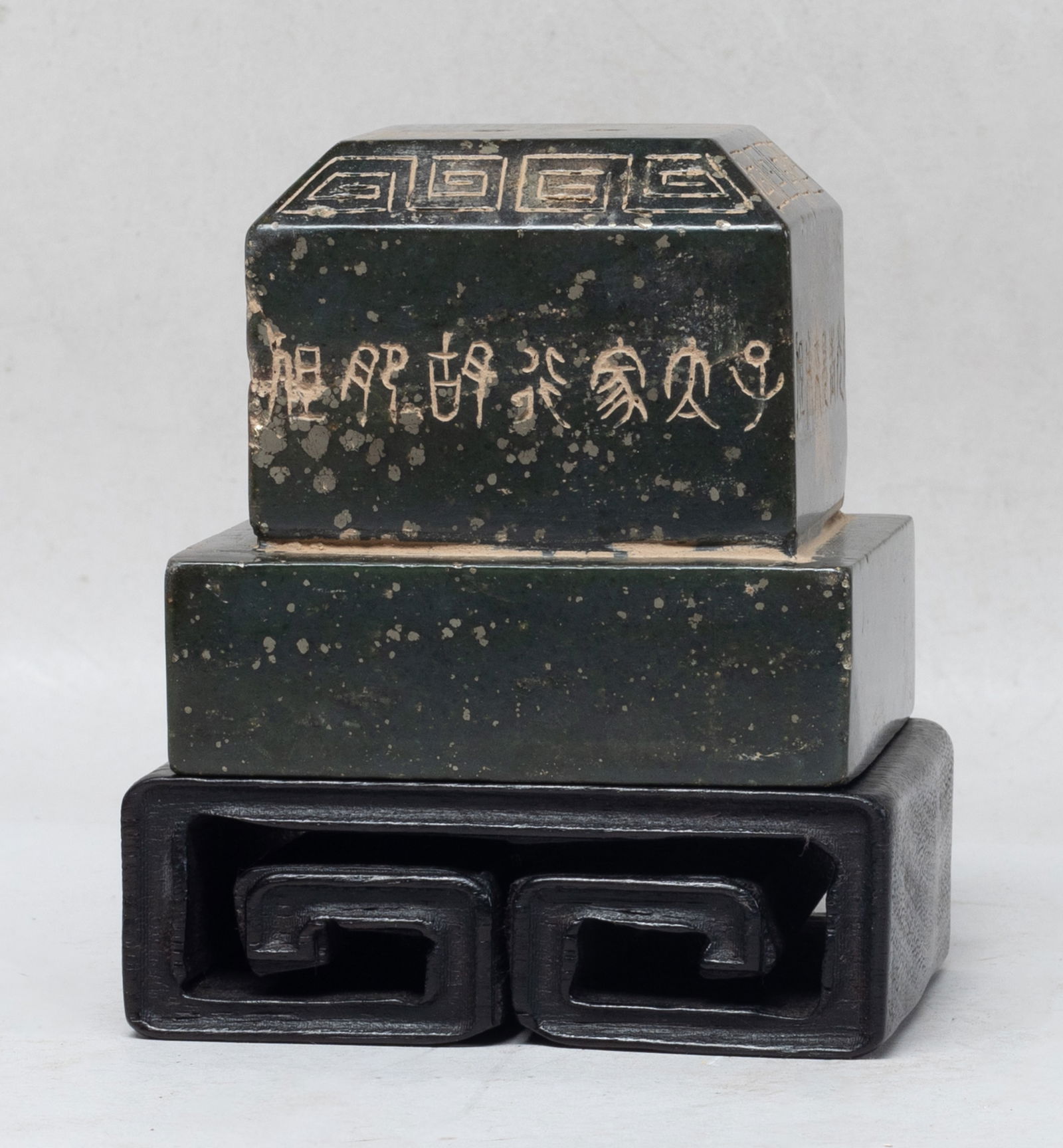 Estate Chinese Spinach Jade Seal: Large Chinese spinach jade seal, of rectangular section, each side incised with ancient characters under a fret band, with stand. Approx. 3.5*3.3*3.2 inch (w/o stand).