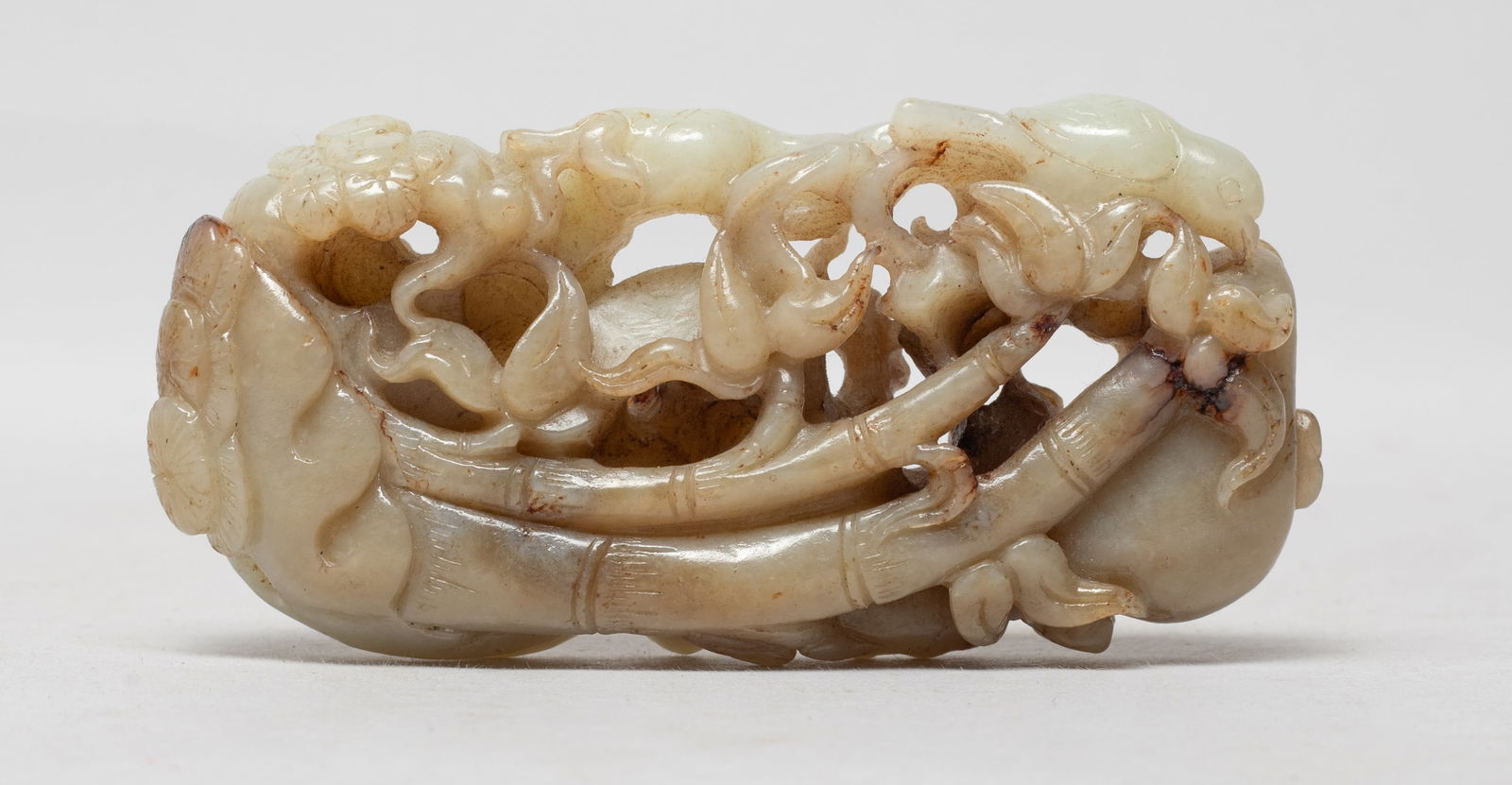 Estate Chinese Jade Carved Plaque: Carved and reticulated with bamboo, plum blossoms and pine tree branches, a bird resting on the top of branch. Approx. 4.15*1.95*0.9 inch.