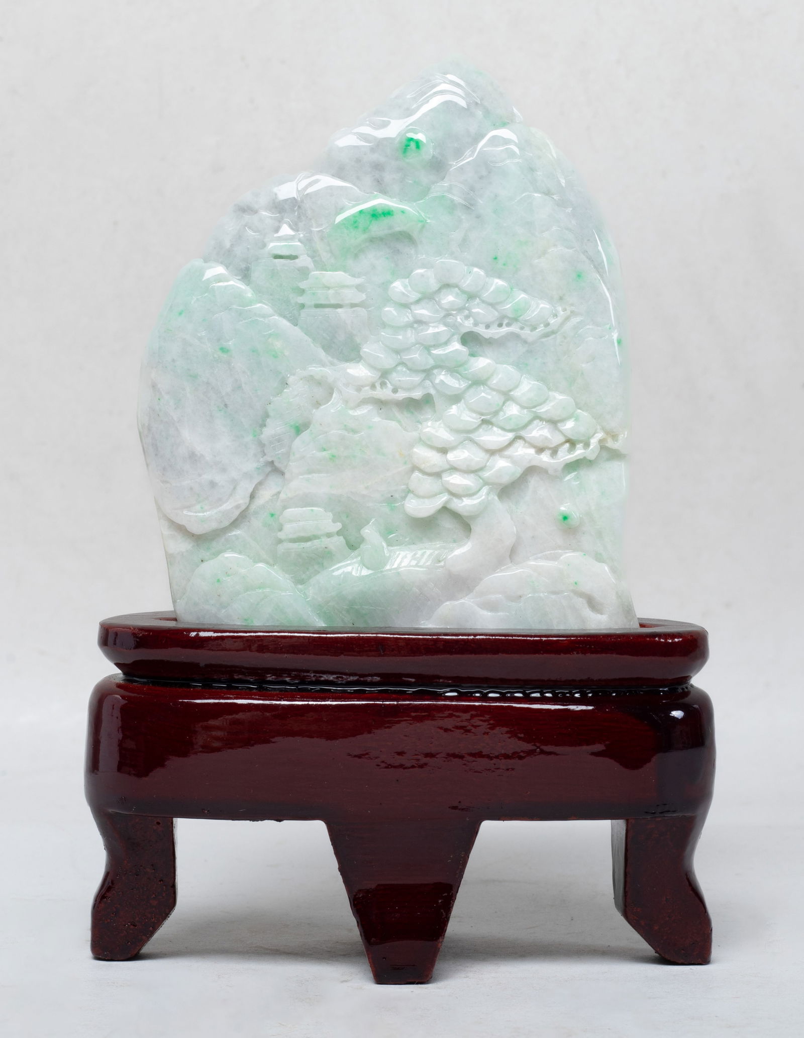 Chinese Export Jade Table Sculpture: Of irregular shape, finely carved with a mountain landscape on one side, with a matched stand. Approx. 4.4*3.4 inch (w/o stand).