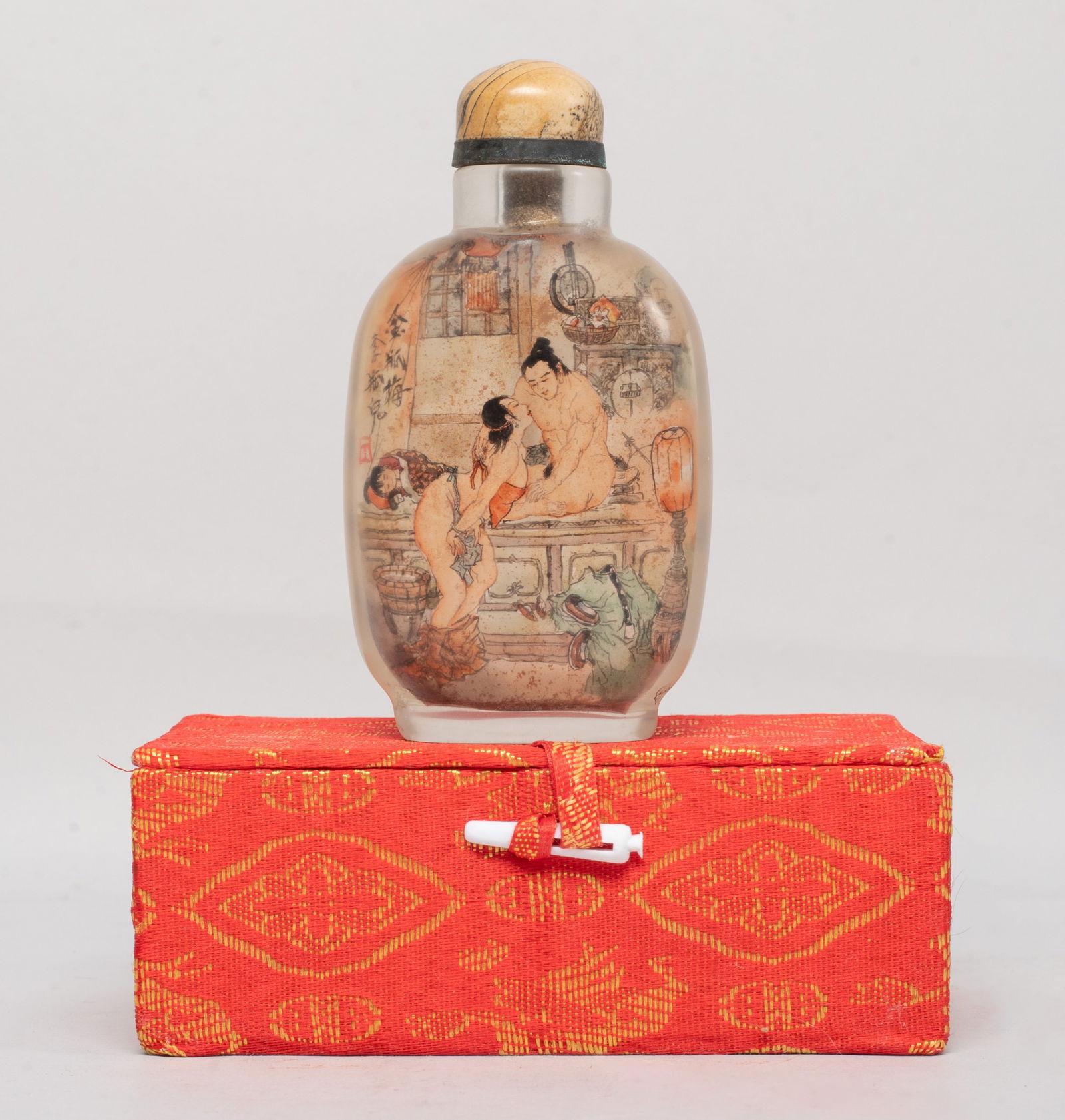 Chinese Inside Painted Glass Snuff Bottle: Chinese glass snuff bottle of rounded rectangular form, the inside painted with a scene of Chinese novel on one side and inscribed with poems on the reverse, with a stopper and a box. Approx.