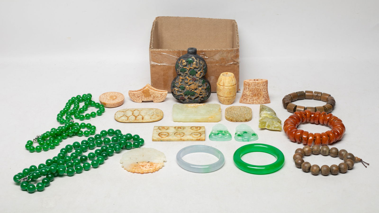Estate Set Chinese Colored Beads, Decors, Carvings: Including bangles, bead necklaces, bead bracelets, stone carvings, and a snuff bottle. Size varies.