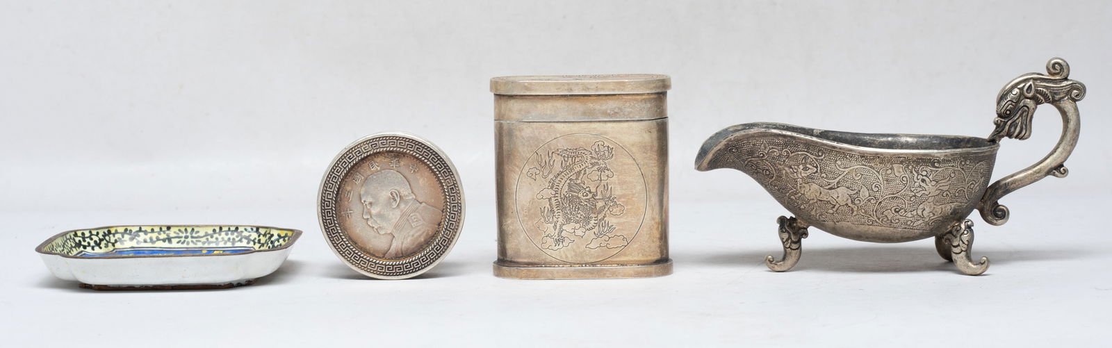 Chinese Export Brass/ Metal Service Sets: Including a cloisonne dish, two covered cases carved with dragons on the sides, and a sauce boat carved with beasts among foliage, with a dragon form handle, the bottom marked with four characters. Ap