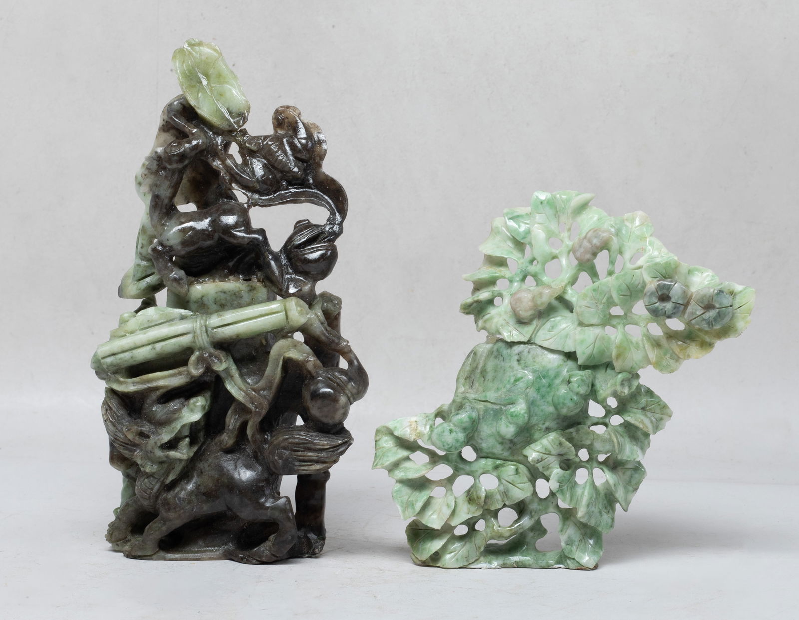 Estate Chinese Export Jade/ Stone Carvings: Two Chinese jade / stone carvings, one carved in openwork with qilin, deer, bat, scroll book, gourd, and censer, the other carved with leafy gourd vines. Approx. 7.4*4*2.2 inch (larger).