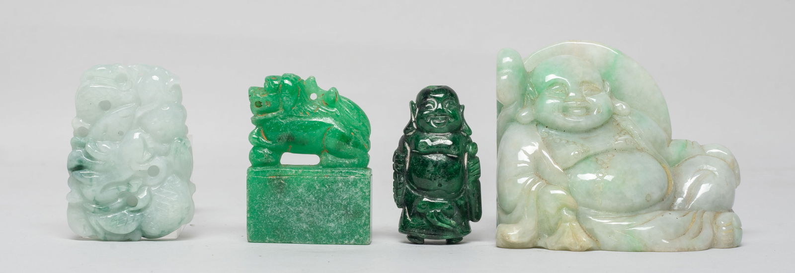 Set Chinese Export Jade/ Stone Carvings: Set of four Chinese jade / stone carvings, two carved with Buddha, one colored stone seal with a beast on the top, the other carved with sinuous dragon and lingzhi. Approx. 2.6*2.1*1.3 inch (largest).