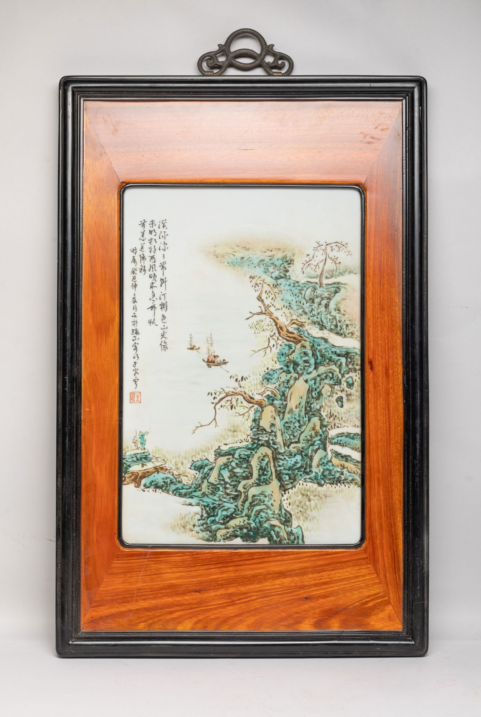 Chinese Export Wood Inlaid Wall Hanging Plaque: Chinese wood wall hanging decor inlaid with a porcelain plaque, painted with riverbank landscape scene, inscribed with related passages. Approx. 22.2*14 inch (frame size).
