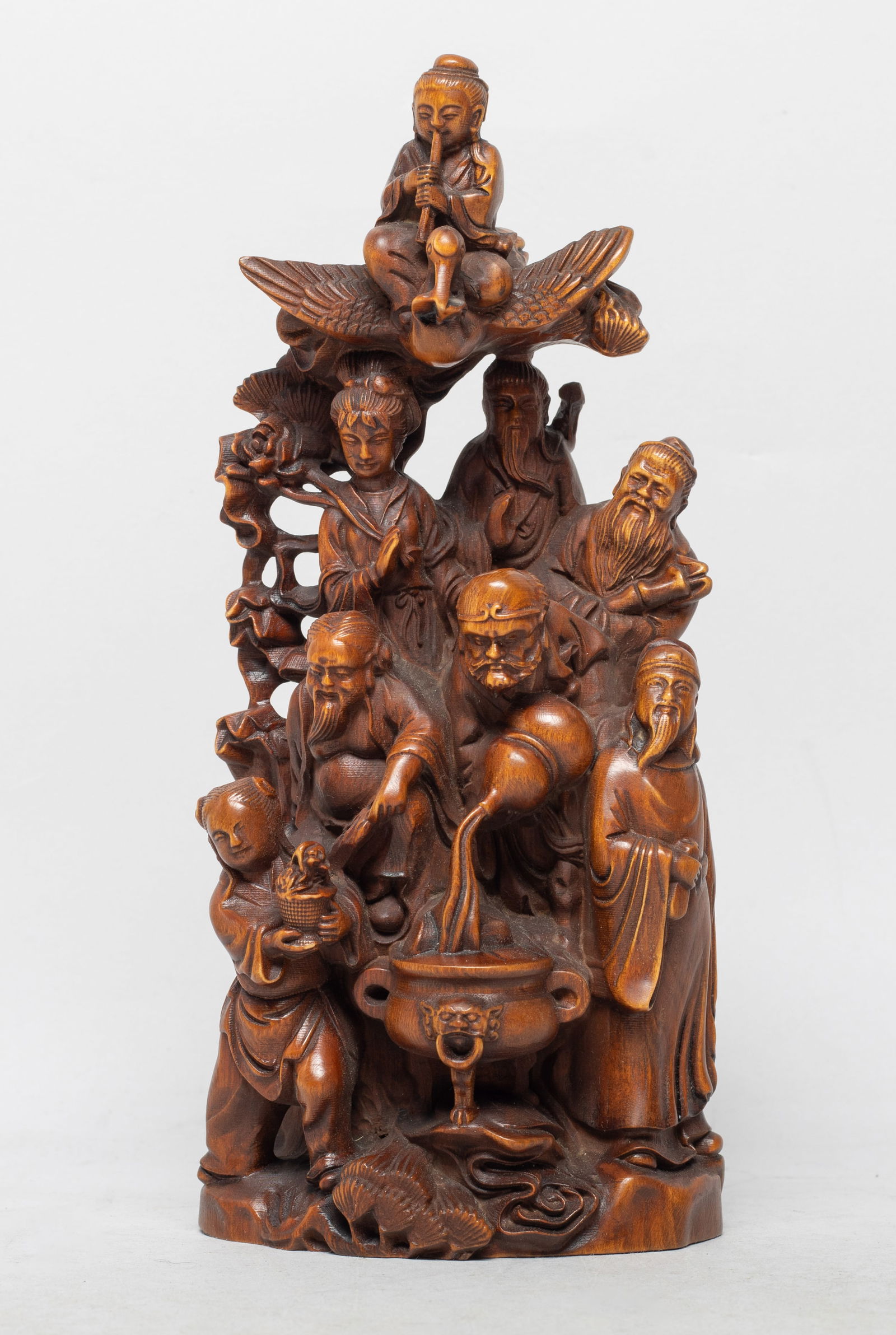 Chinese Export Wood Table Sculpture: Chinese wood table sculpture, carved as Daoist Eight Immortals in various activities, wherein one immortal sitting on a crane above. Approx. 7.7*3.5*2.5 inch.