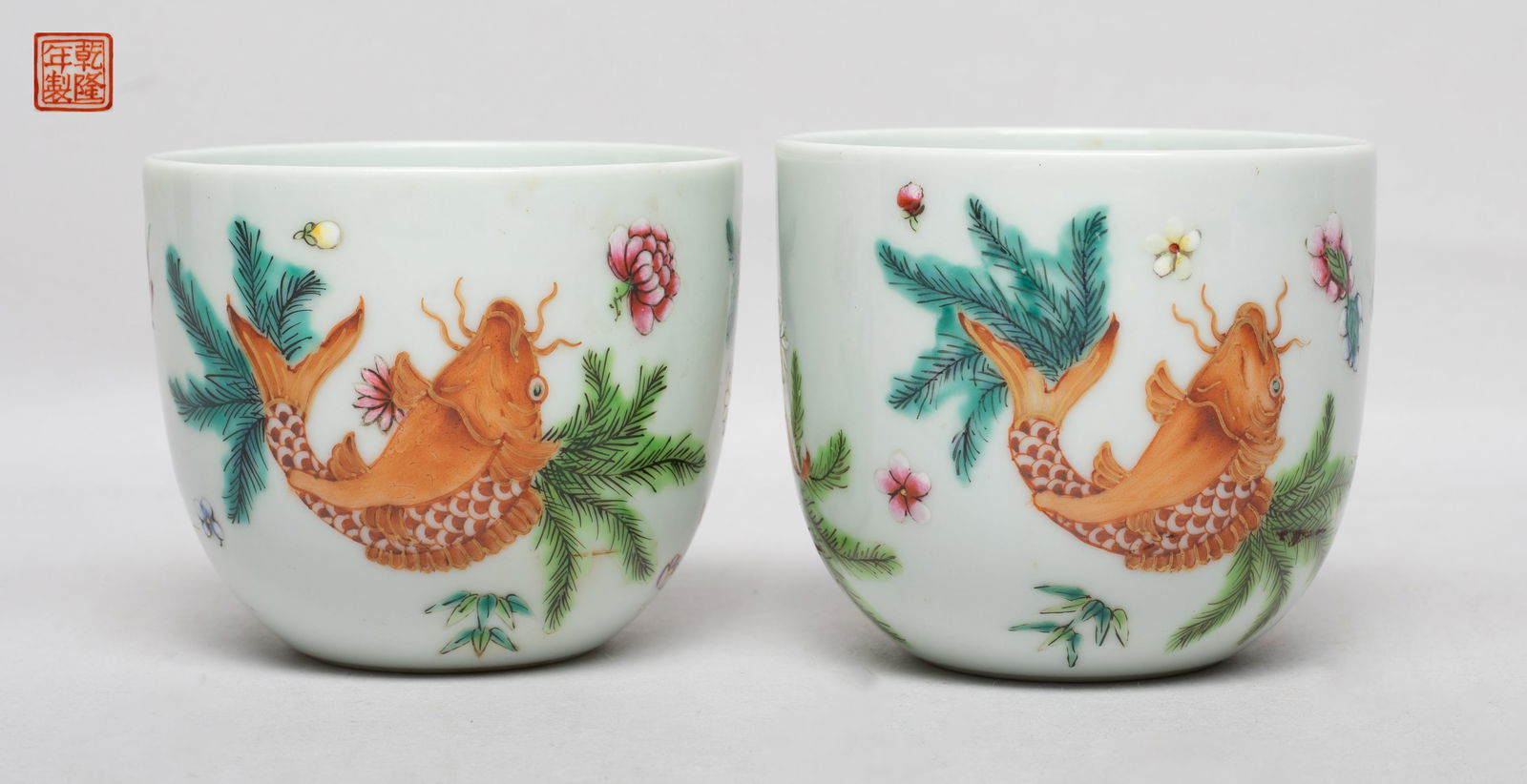 Two Chinese Export Porcelain Tea Cups: Each cup exterior enameled and painted with catfish, flowers and water plants, the bottom with a copper-red seal mark. Approx. 2.77*3.17 inch (each).