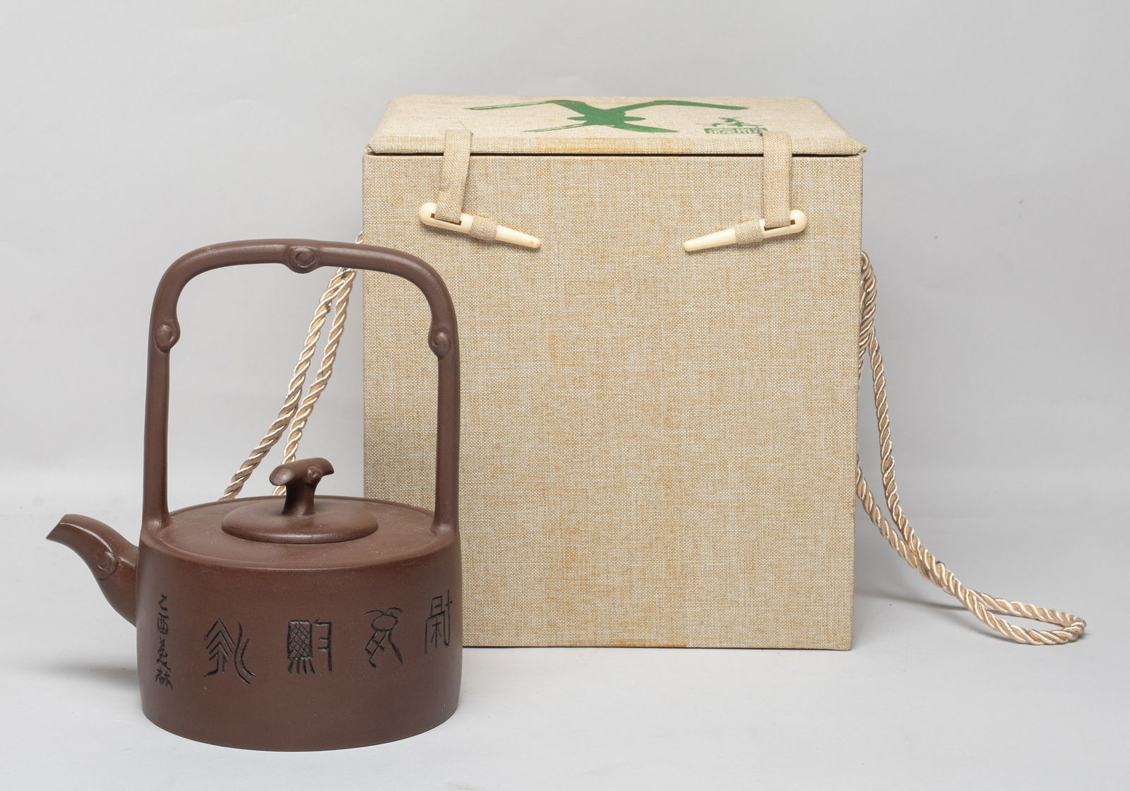 Collectible Chinese Vintage Yixing Zisha Tea Pot: The tea pot body inscribed with ancient characters, the lid interior incised with two marks, the pot bottom with a seal mark, with box. Approx. 6.7*6*4.7 inch (w/o box).