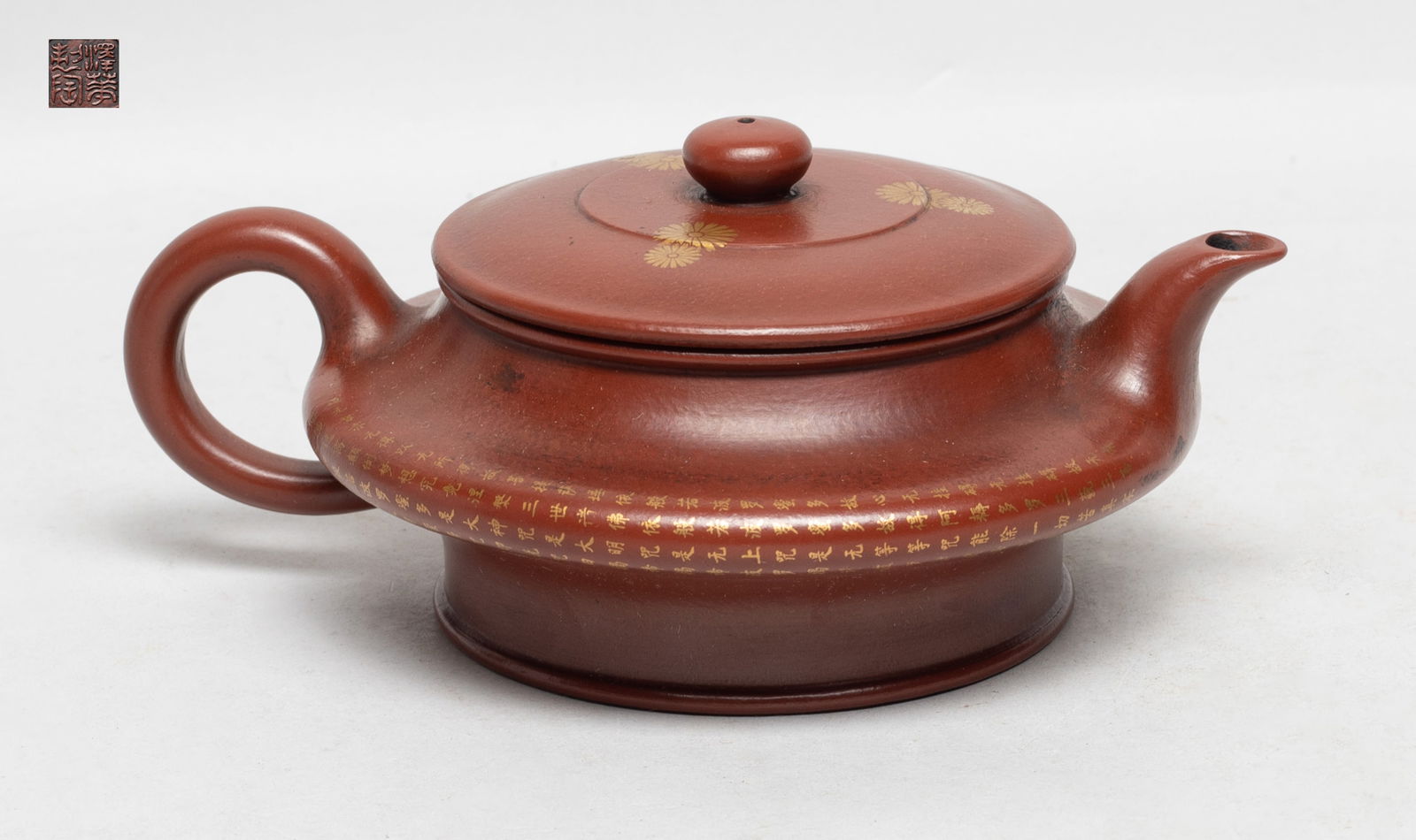 Estate Chinese Yixing Zisha Tea Pot: Special shape zisha tea pot, the body inscribed with Buddhist texts, the lid painted with flowers, the lid interior with two marks and the bottom with a seal mark. Approx. 6.1*4.6*2.6 inch.