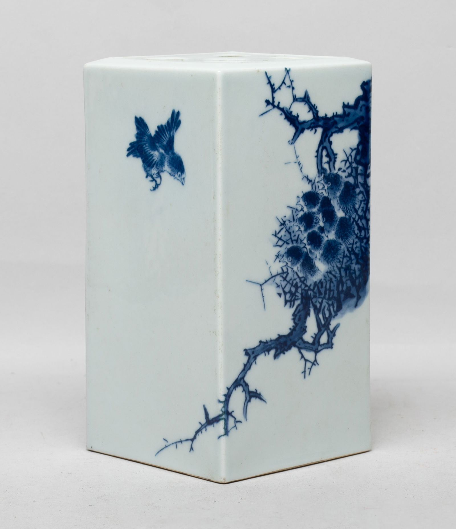 Chinese Blue & White Porcelain Incense Holder: Of tall square section, the exterior painted with a bird flying towards a group of little birds in a nest on a tree, inscribed with related passages, the bottom with a six-character mark, the top pier