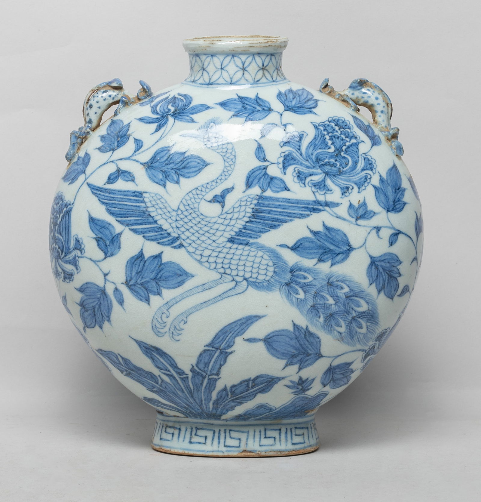 Chinese Shipwreck Type Porcelain Vase: Of flattened rounded form, either side painted with a peacock among leafy lotus sprays, set with two raised beast form handles. Approx. 9.5*8.5*4.5 inch.