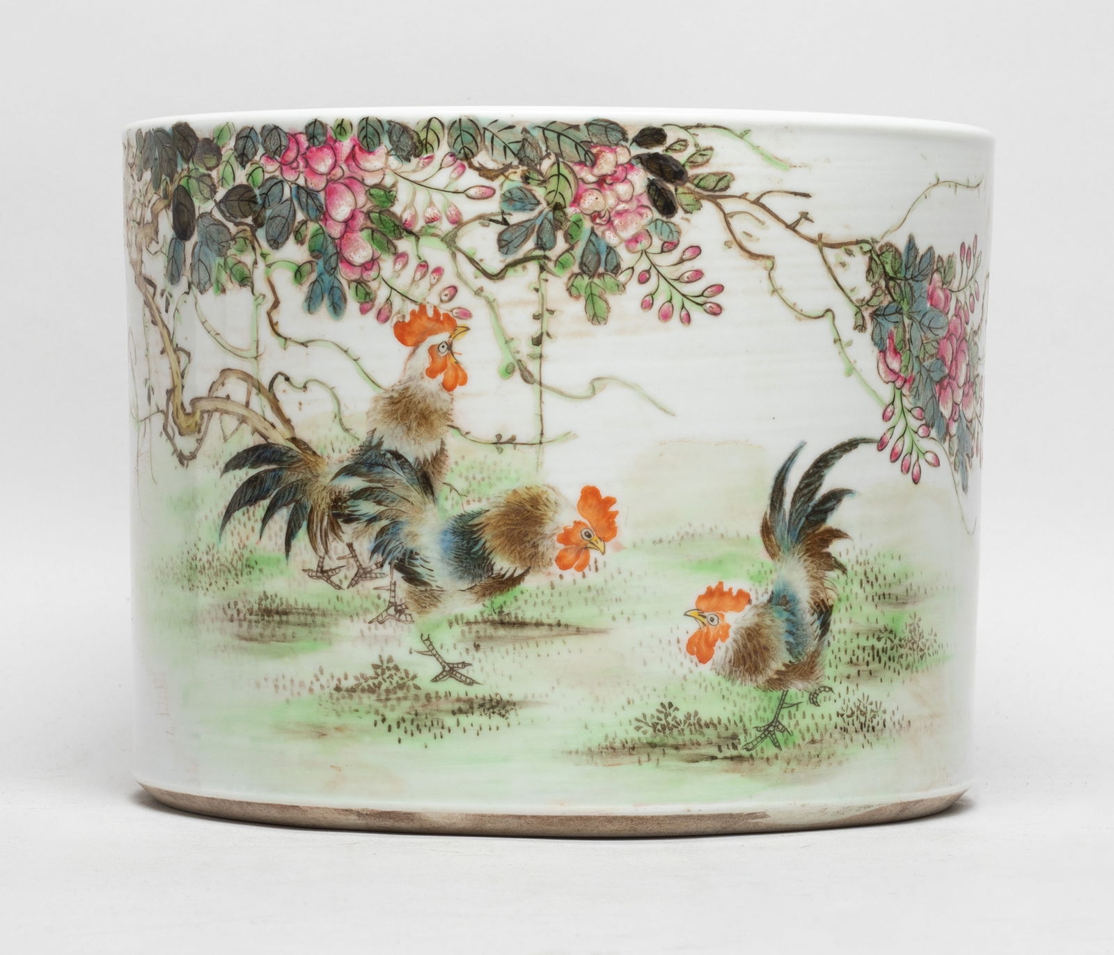 Chinese Famille Rose Porcelain Brush Pot: Of cylindrical form, the exterior painted with three roosters under blossoming wisteria, inscribed with related passages. Approx. 7.7*6 inch.