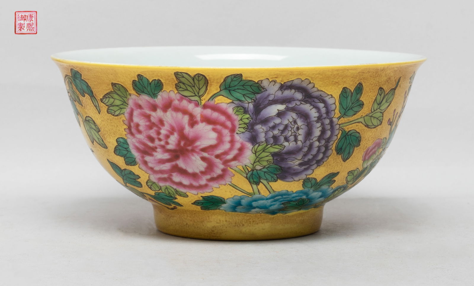 Collectible Chinese Export Porcelain Deep Bowl: The bowl exterior decorated with blossoming peony on yellow glazed body, the bottom with a seal mark. Approx. 6.1*2.8 inch.