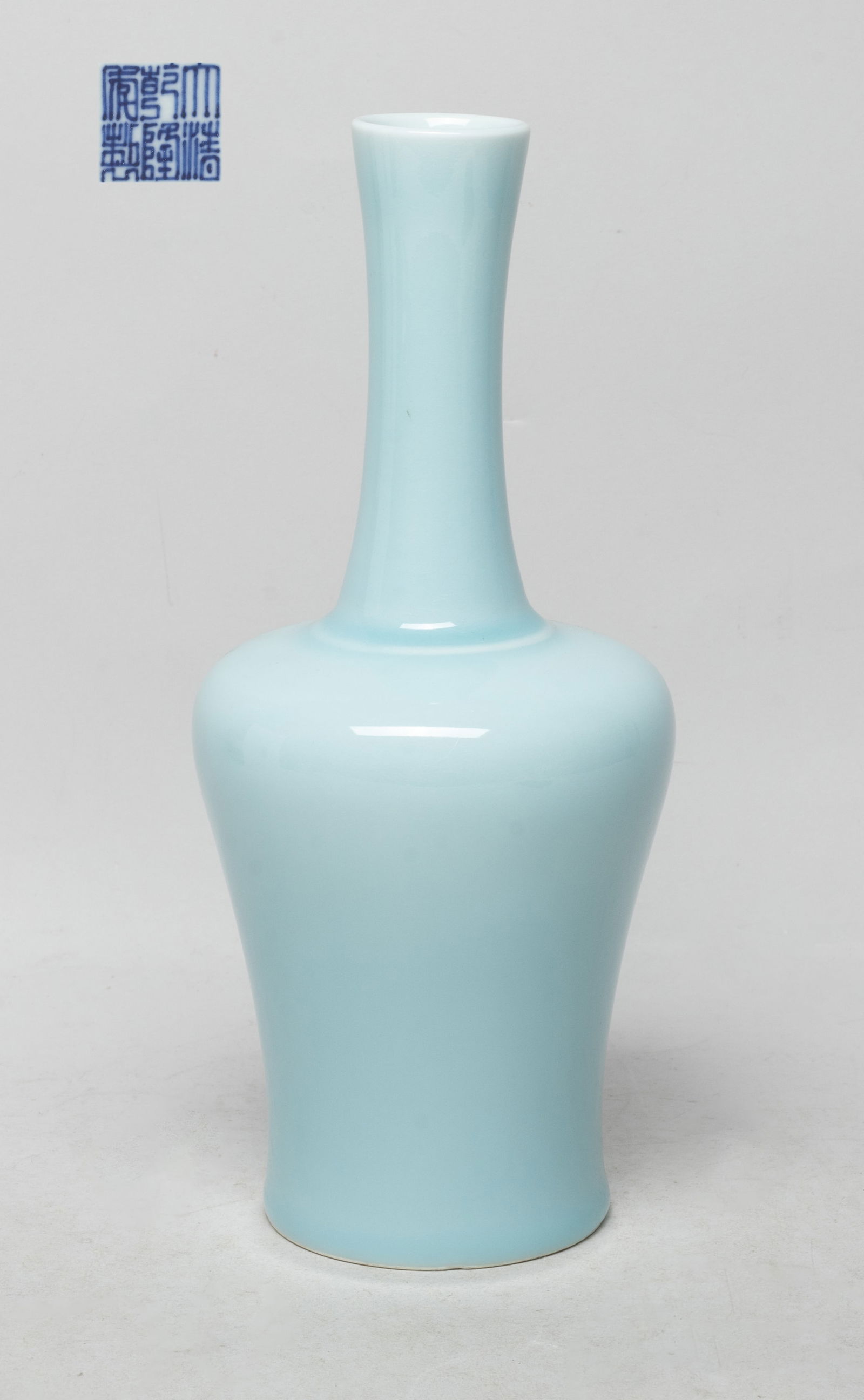 Estate Chinese Export Porcelain Vase: The tapered baluster body rising to a tall slender neck, the exterior applied with pale blue glaze, the bottom with a six-character mark. Approx. 9.2*4 inch.