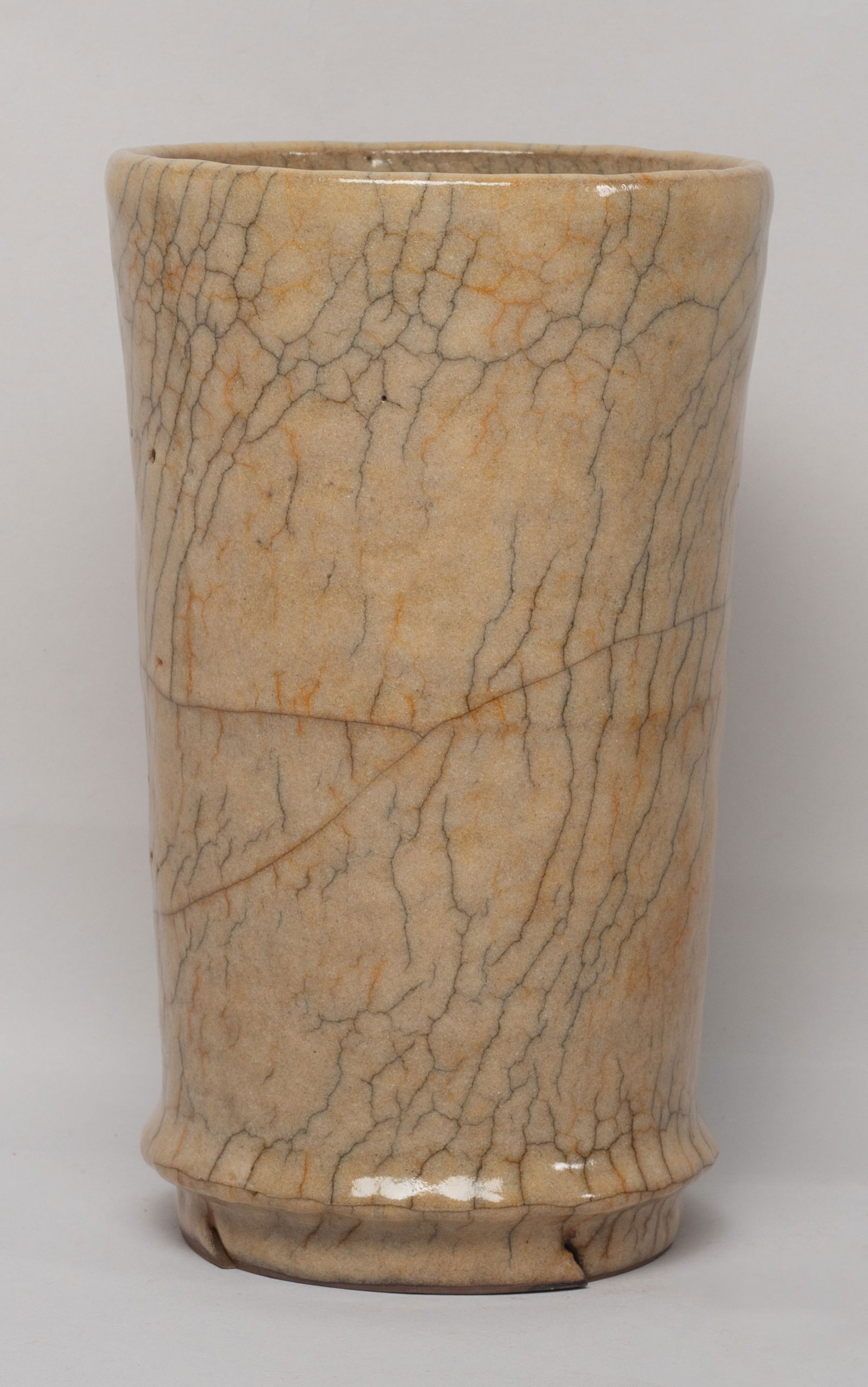 Tall Chinese Ge Type Porcelain Cup: Of gently flared cylindrical form, overall covered in mottled mushroom-color glaze suffused with black and brown crackles. Approx. 6.7*4.1 inch.