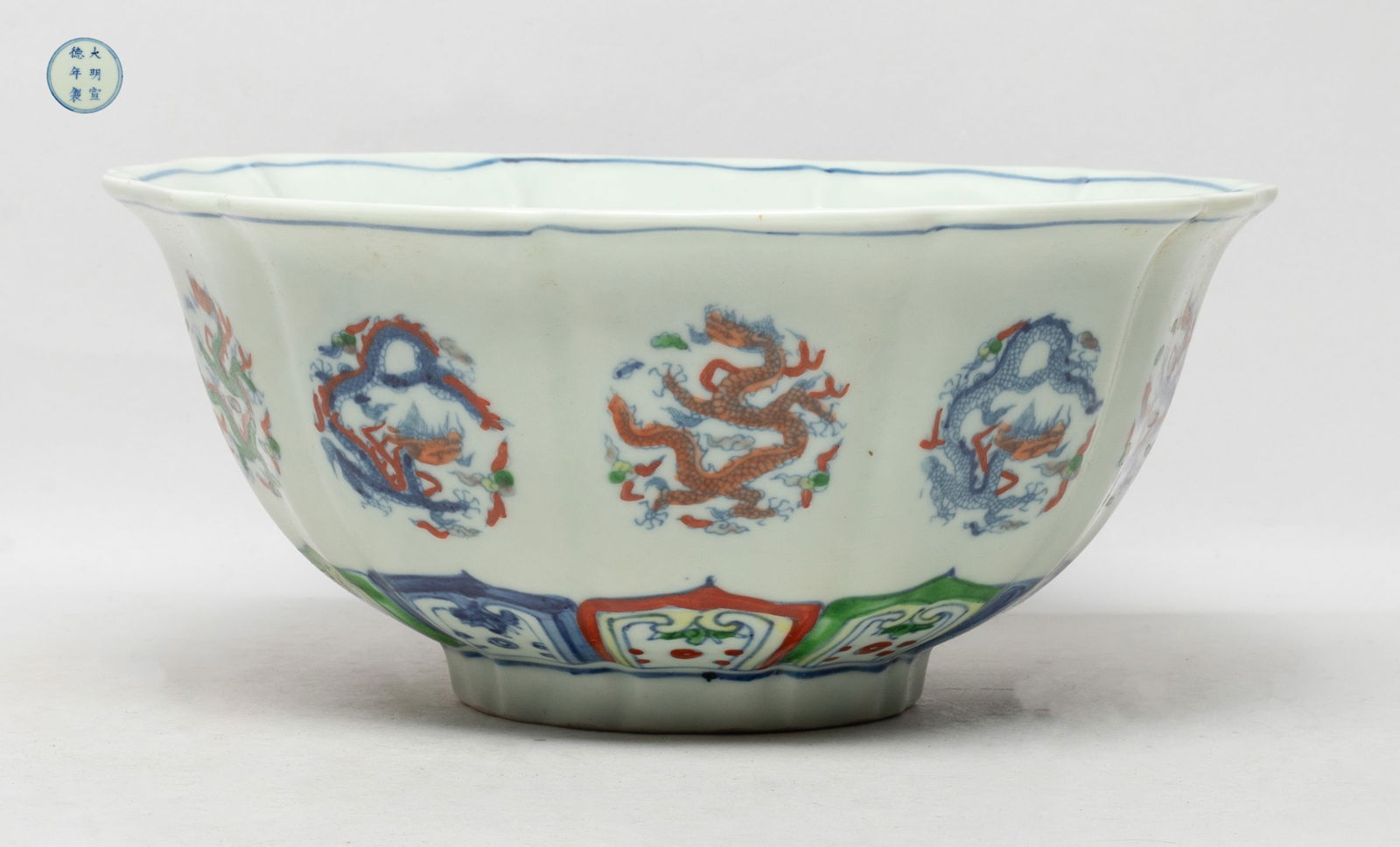 Chinese Export Douchai Porcelain Large Bowl: The large deep bowl of floral form, each side on the exterior painted with a dragon sinuous among clouds forming in circular shape above petal, the interior centre with similar dragon, the bottom mark